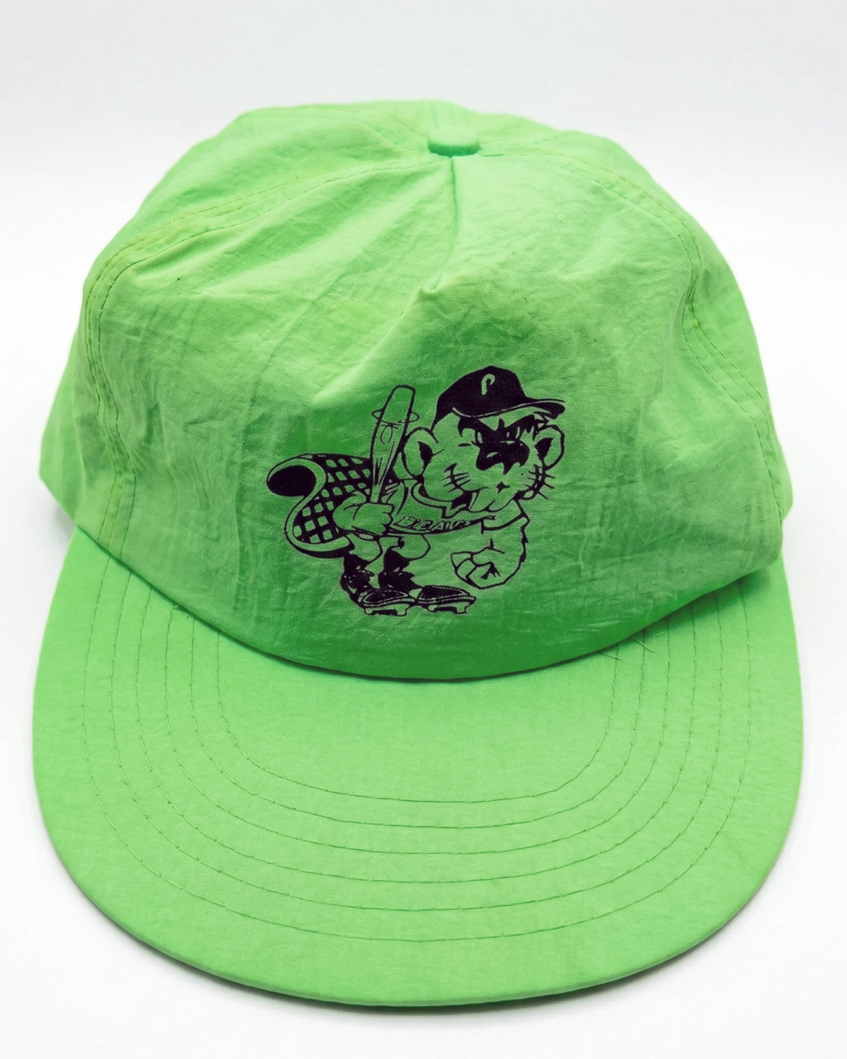 A bright green baseball cap with a cartoon graphic of a cat wearing a hat and glasses, holding a baseball bat.