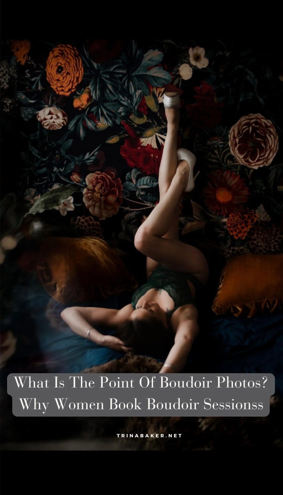Woman posting in boudoir studio in front of flower wall.