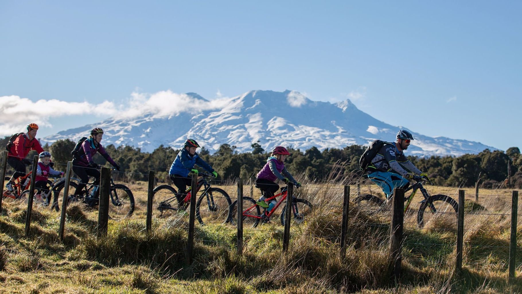 Group of friends cycling the start of the Ohakune Old Coach Road with Mt Ruapehu in the background - Visit Ruapehu.jpg