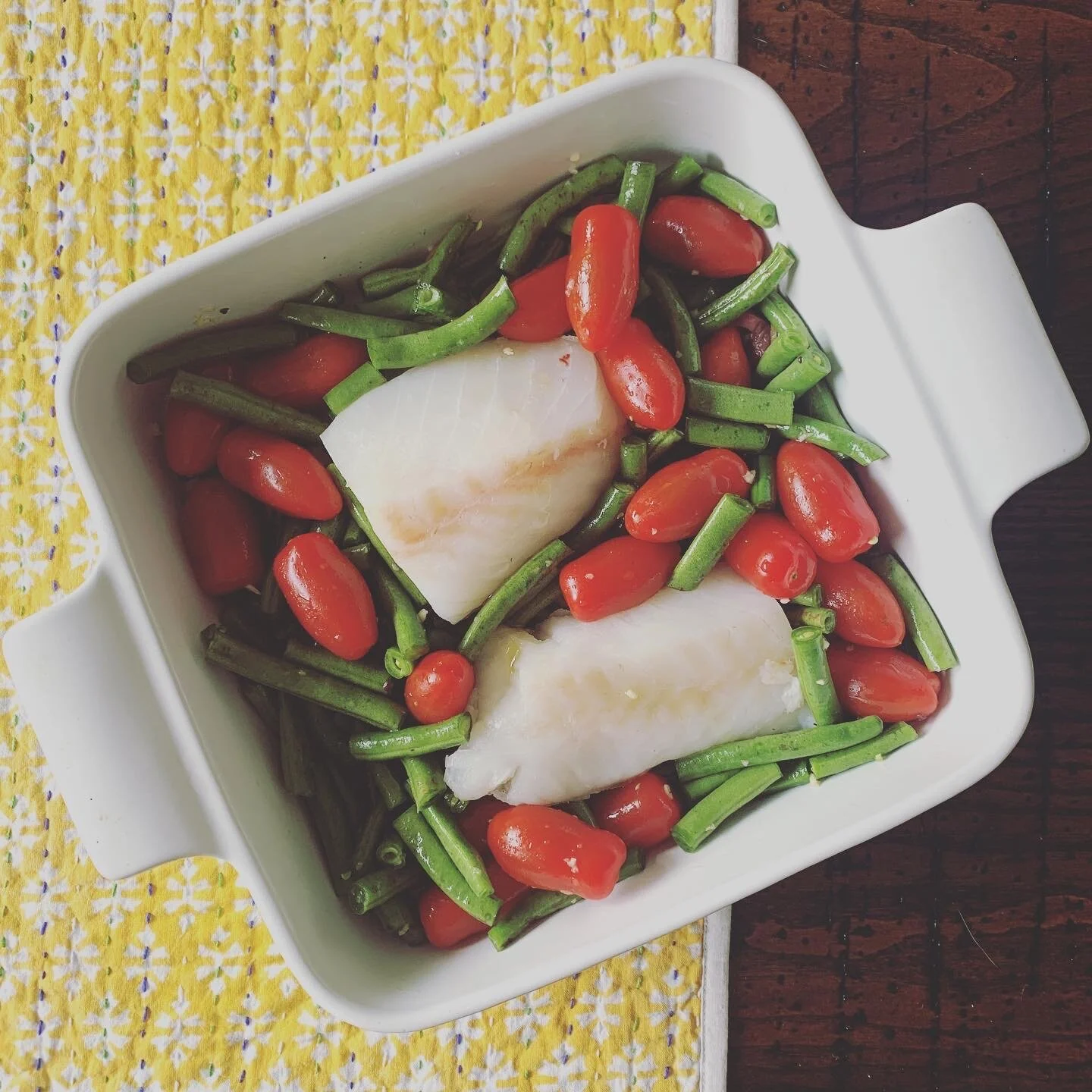Fresh and colorful fish dinner using very little oil and salt. Letting the foods natural flavors come out and marry together as they baked. 