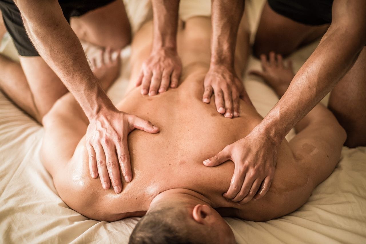 Four handed gay massage