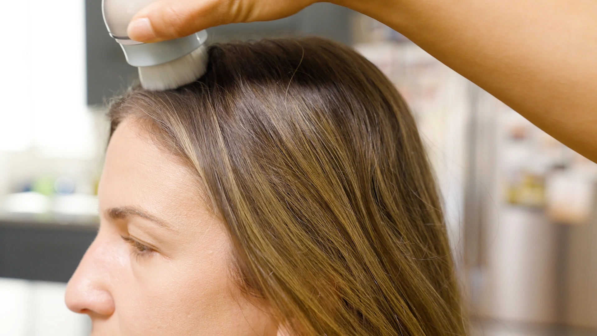  Start from front to back and apply the  m’Chel Haircare Day After Brush  dry shampoo throughout the whole head of hair. 