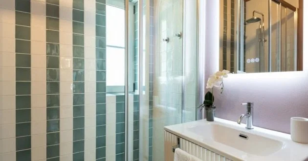 Bathroom surfaces do more than finish walls and floors. They reflect light, add texture, and define the character of a space. I guide every tile, stone, and finish selection so the result feels intentional, timeless, and beautifully resolved.

#TheHa