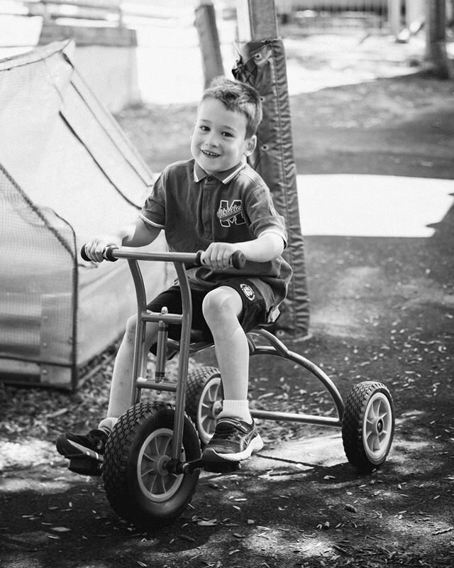 This cute little guy is Ollie... his cheeky smile catches my imagination. He was on a mission - peddling around the outside path of the play equipment. I captured this shot while doing the class photos for @leap_ahead_preschool_llc last year.⠀⠀⠀⠀⠀⠀⠀⠀