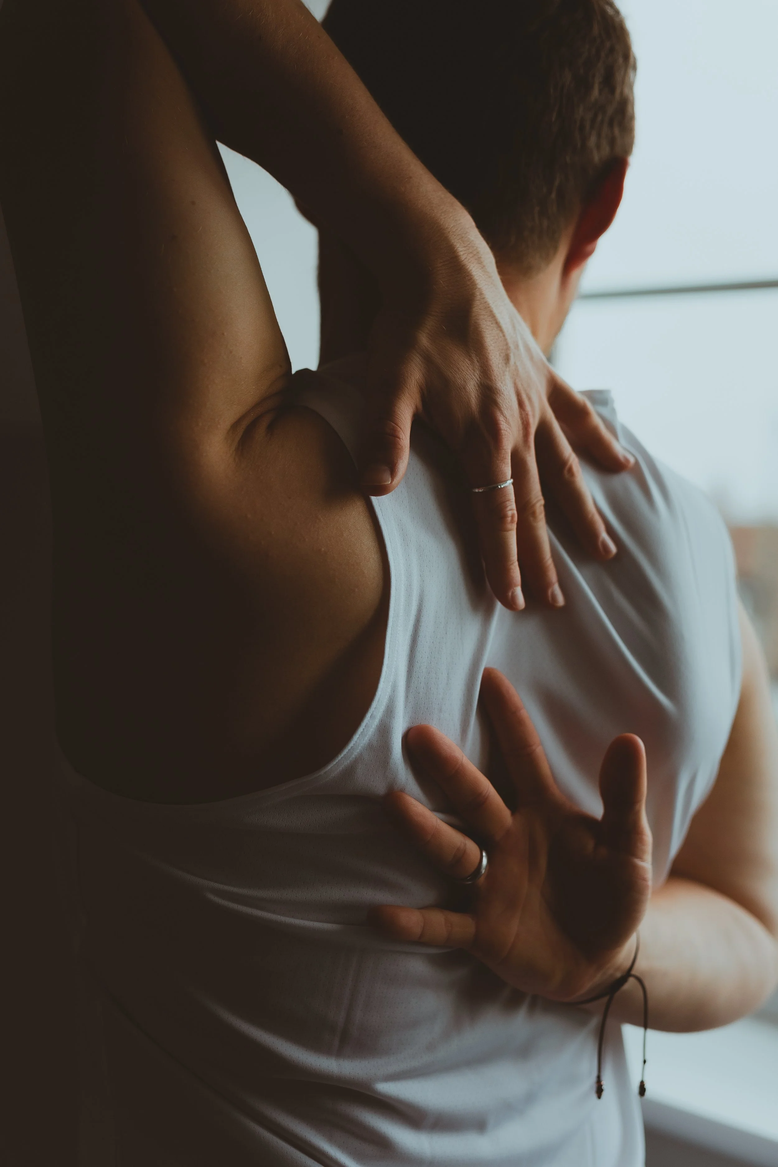 Moody cinematic atmospheric photo of man doing yoga in a window in Oulton Broad Lowestoft Suffolk 