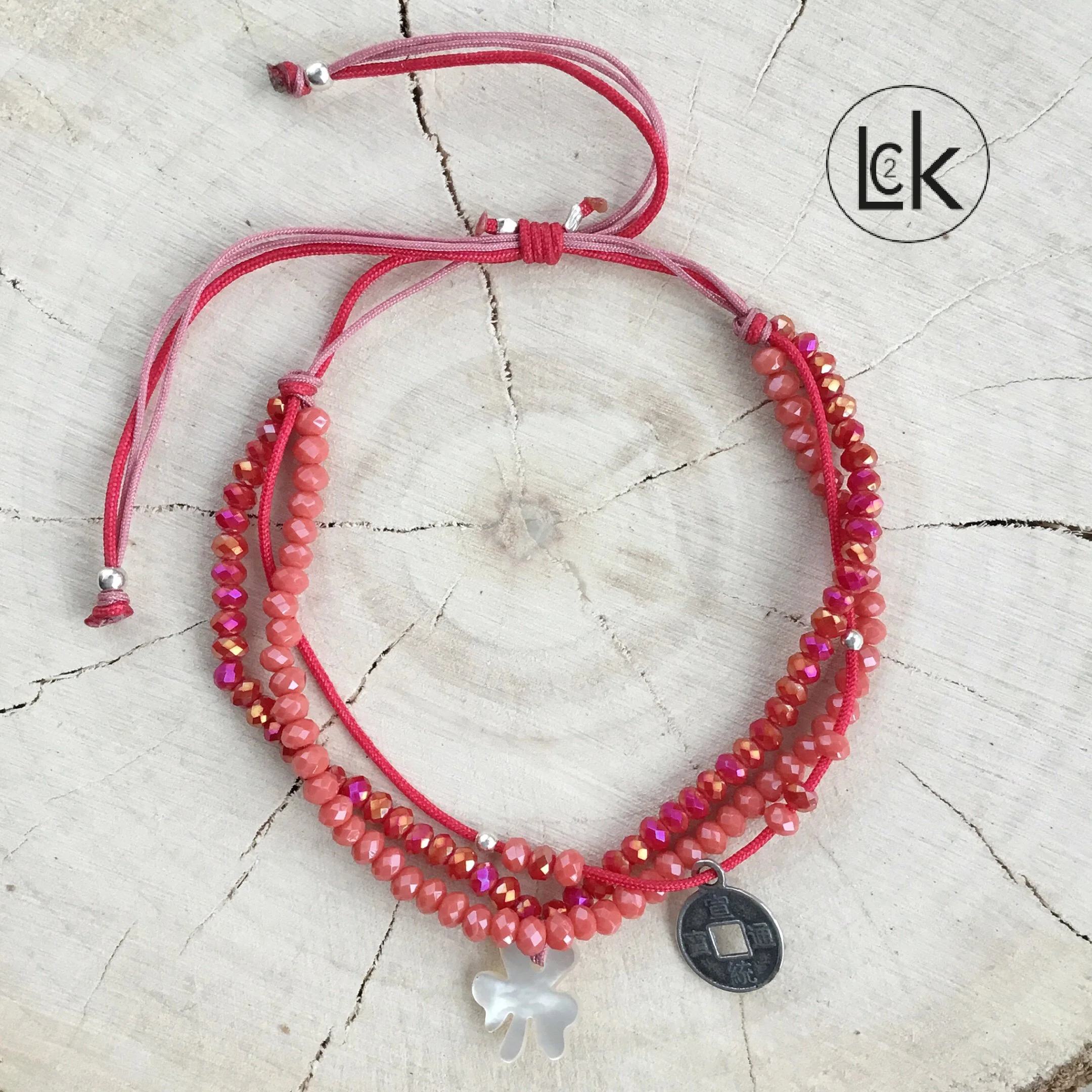 Bracelet porte bonheur Rouge/ Orange amulette Trèfle