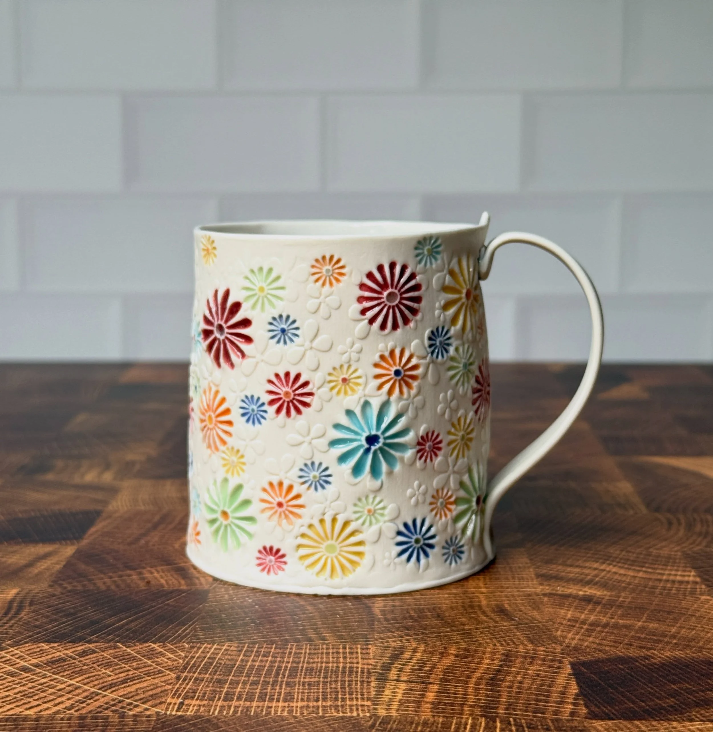I just received 2 unsold Daisyware mugs from a gallery exhibition, and they are now listed in the shop.  Both are marked down and you can take an additional 10% off with code SPRINGCLEAN entered at checkout!  Now through Monday, May 25th. Pretty much