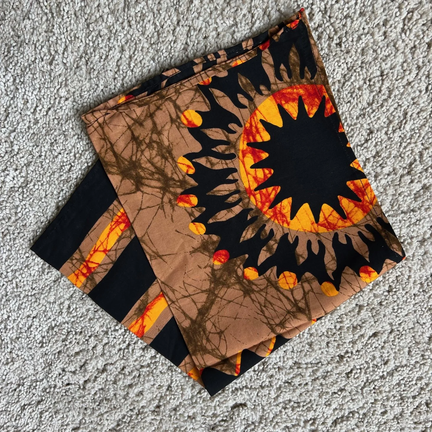 Brown and orange Kitenge dish cloth; size 44x52cm.
Price €5