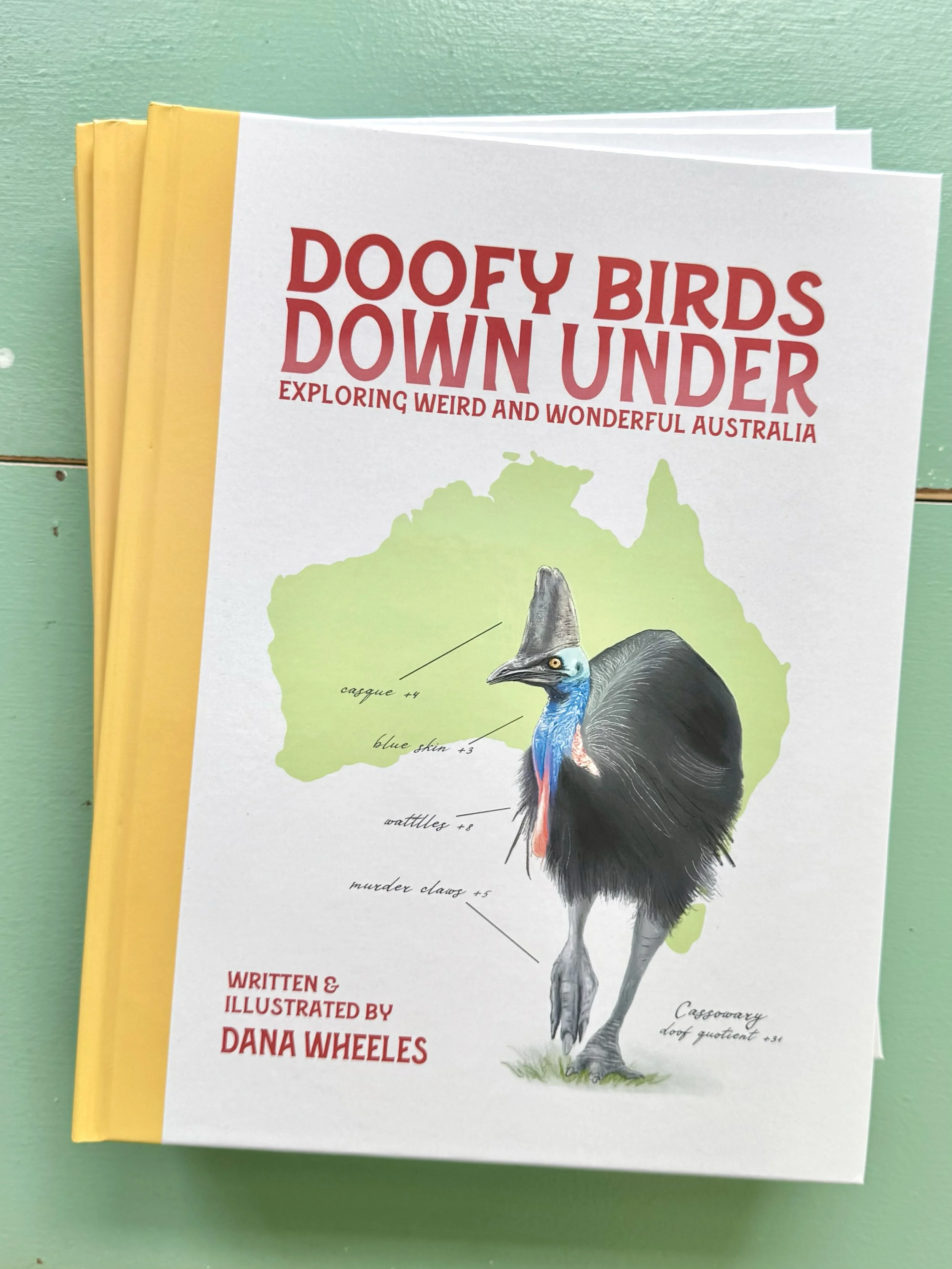cover of a book with a yellow spine that features a cassowary