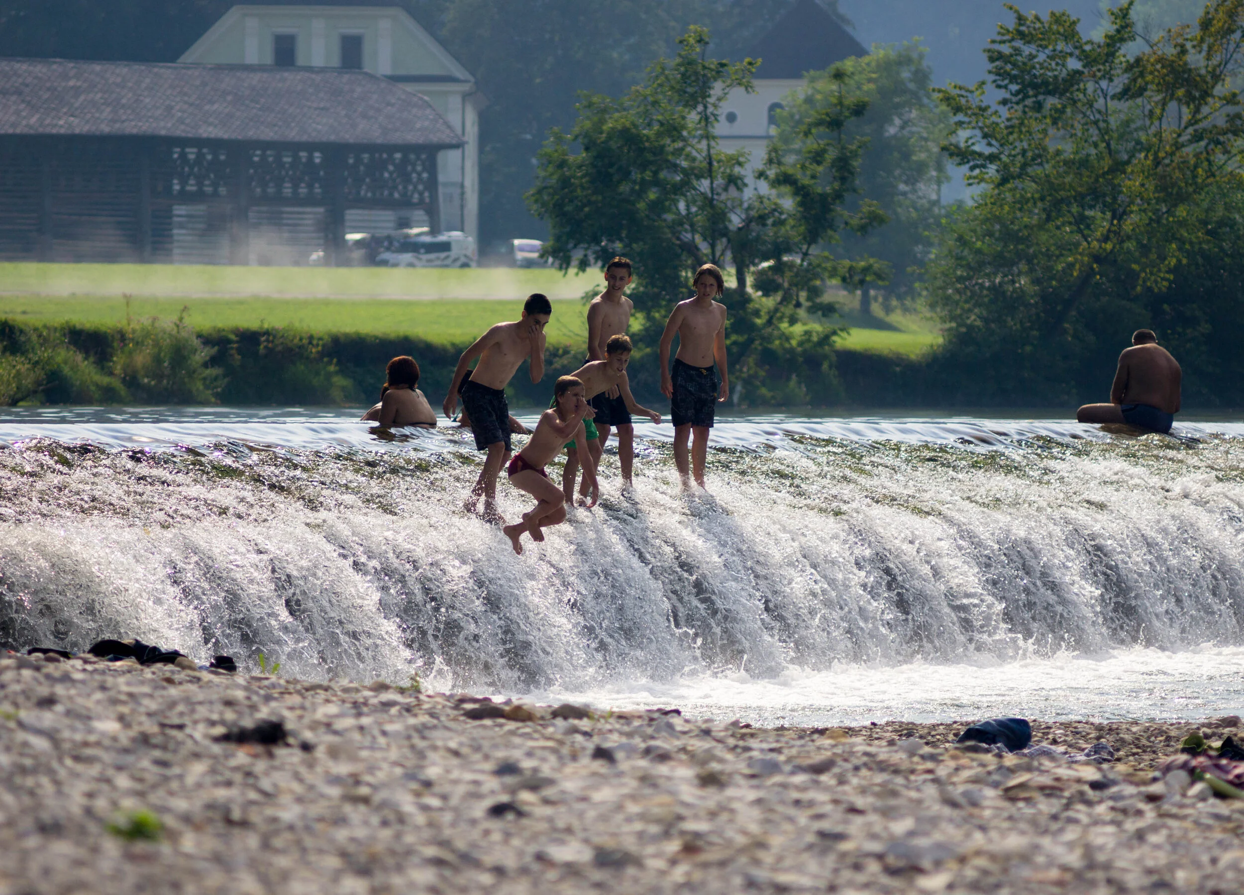 Kids jumping into the Sora river