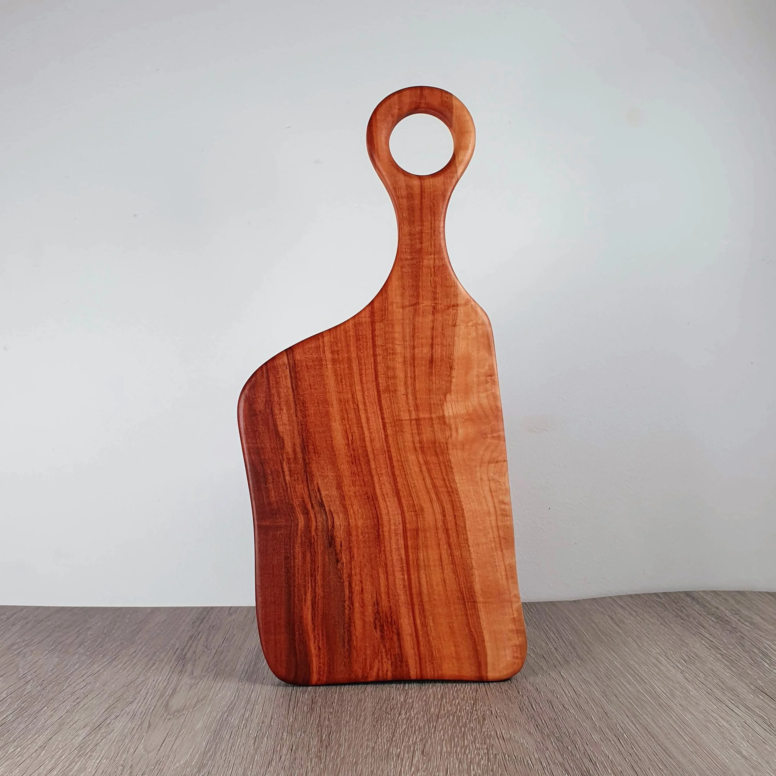 A handmade wooden cutting board.