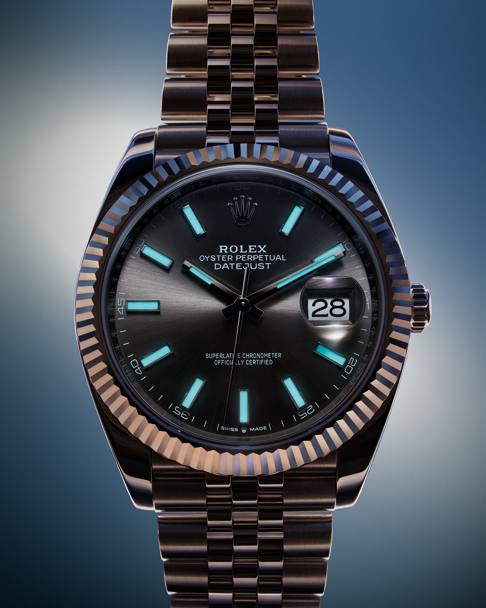 Rolex Oyster Perpetual Datejust watch with a dark face, glowing blue hour markers, and a metal band.