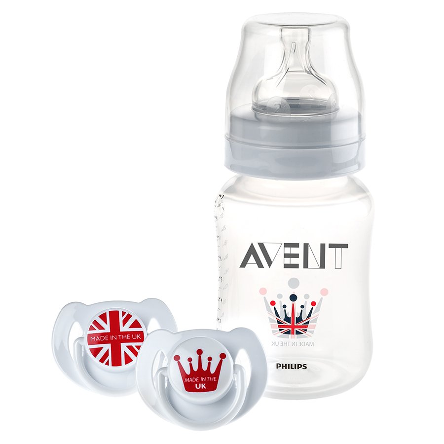 A baby bottle with a Philips AVENT logo and two pacifiers, one with a British flag and the words 'Made in the UK' and the other with a crown and the words 'Made in the UK'.