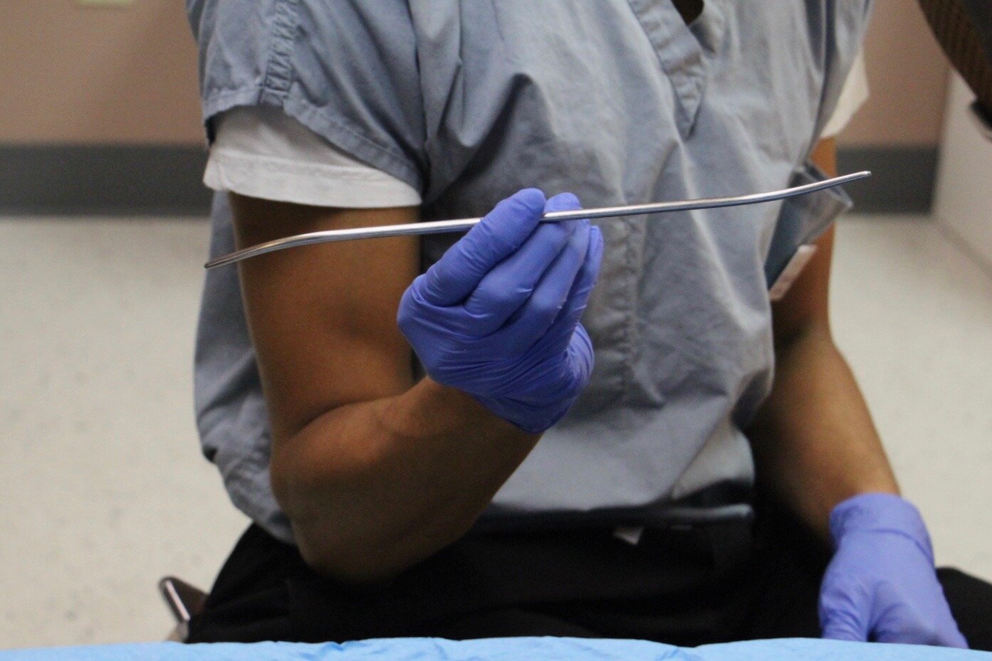 Dr. Kumar holds a cervical dilator
