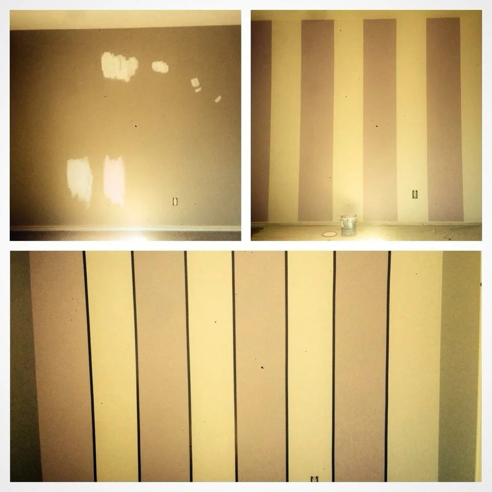 Three photos showing the process of painting and applying striped wallpaper to a wall in a room. The top left photo shows a wall with patches of primer or paint patches. The top right photo shows the same wall with vertical stripe wallpaper partially