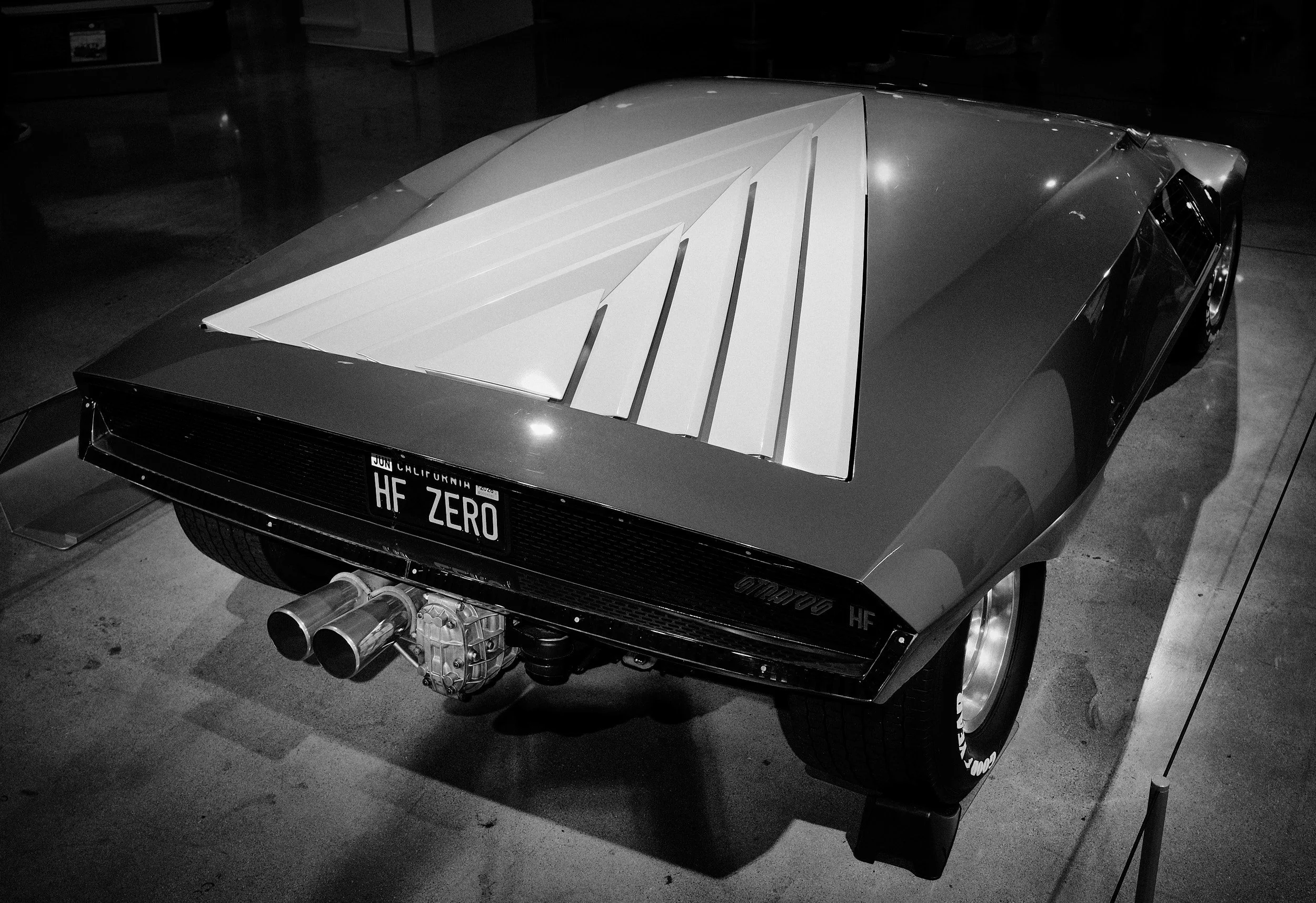 Dramatic “hood” that is vented to allow air in or out, and hinges on one side of the triangle.