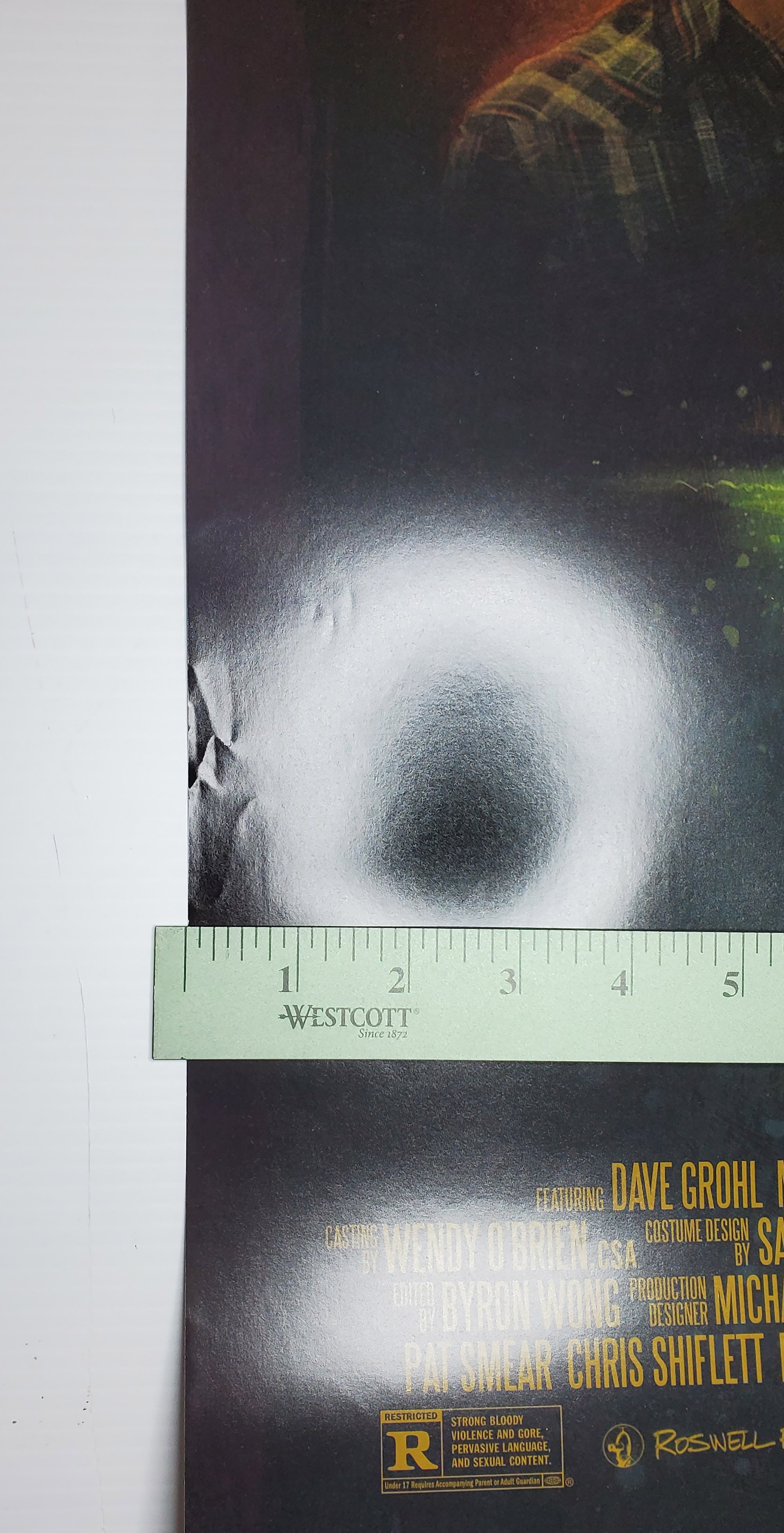 crease at poster edge in strong light