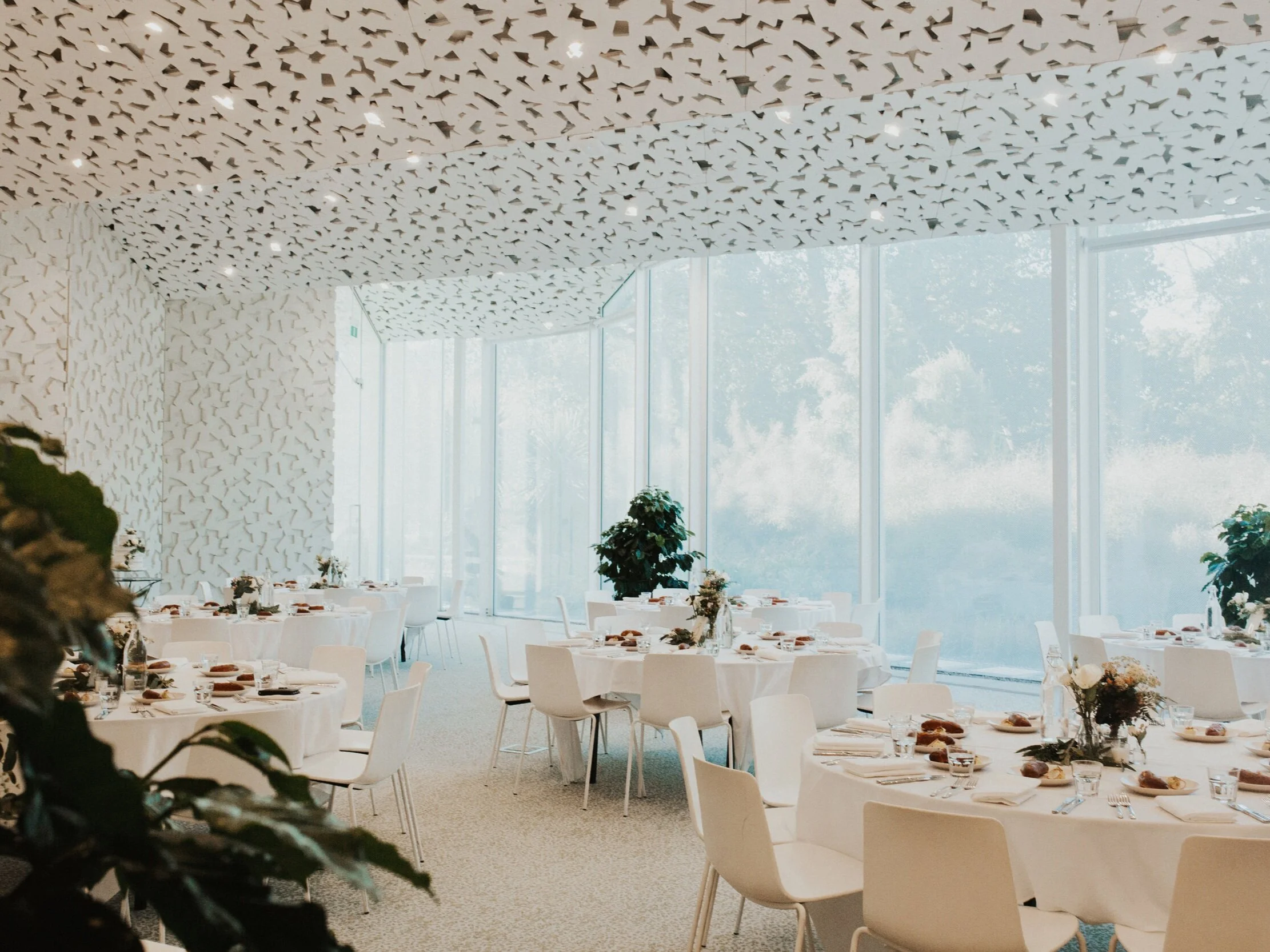 ilex Events  Naturally Unique  Hidden away from the bustle of the city, among the 150-year-old Holm Oaks, Ilex stays true to the rich origins and beauty of the breathtaking Christchurch Botanic Gardens. Situated at the centre of this world-renowned site, along the banks of the Avon River, Ilex event spaces are designed to complement the nature around us. This is a secluded sanctuary in the heart of Christchurch.  From design through to service, we’re passionate about creating unique event experiences with effortless attention to detail.    Capacity  300