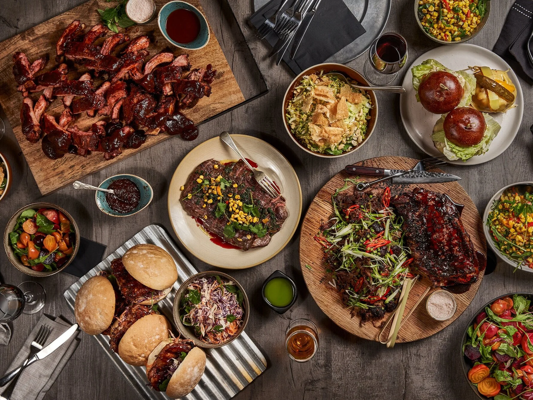 BBQ Cartel  As much as we love to serve, we love to create. Our pit masters are true masters of their craft. Through years of practice they intuitively know exactly when to flip a brisket, what spices make a perfect rub and how to keep the embers burning at just the right heat to lock in flavours and juices. BBQ Cartel is made up of four key BBQ styles: American, Argentinian, Asian Fusion and Kiwi. Our BBQ styles are an art that must be mastered through experience, and it makes for a difference you can taste in the food we create.