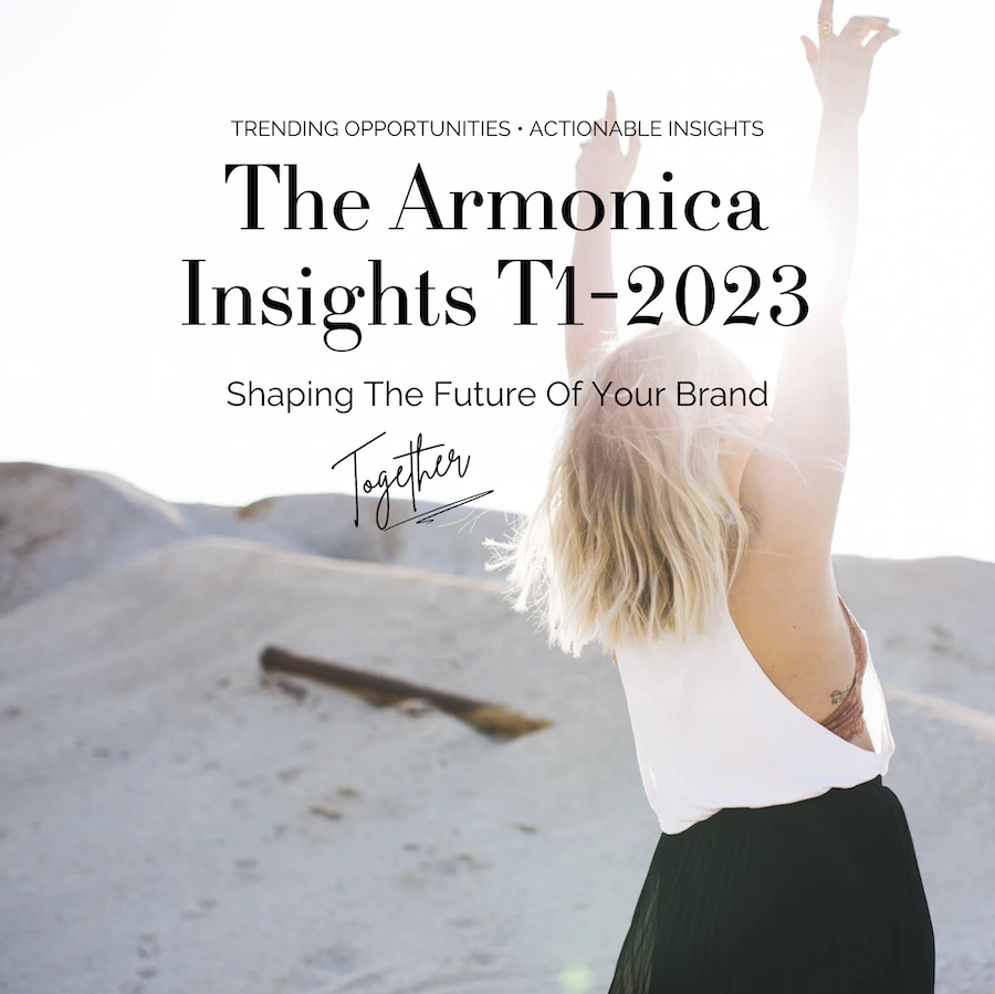 Cover photo of The Armonica Insights T1–2023 showing a girl in the sun with her hands up to the sky on a sandy beach