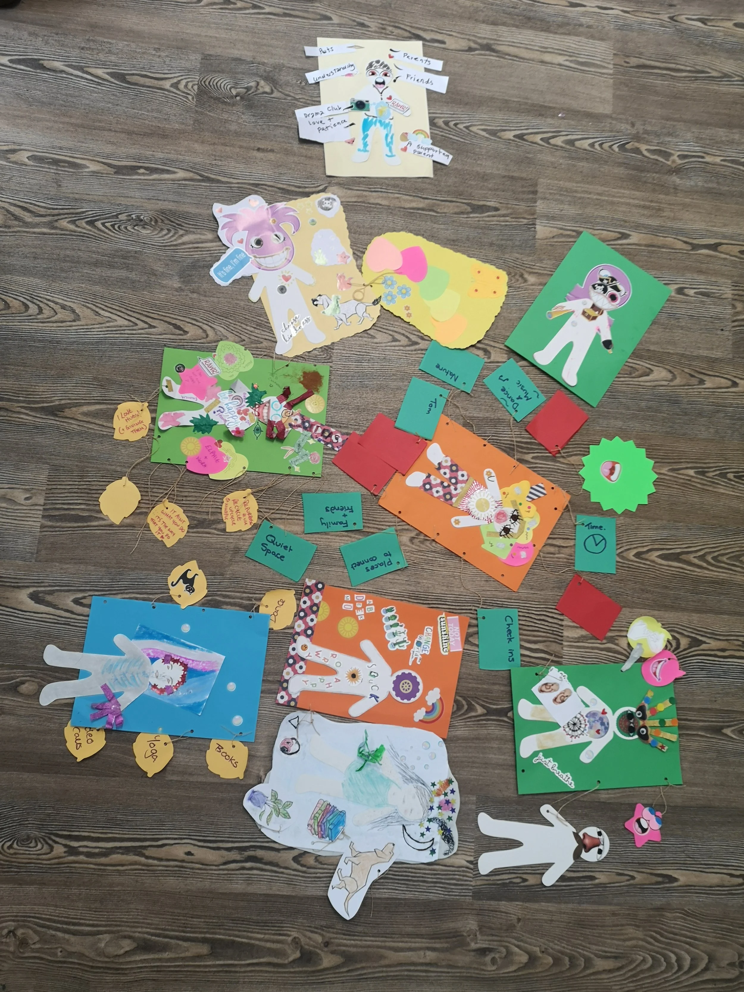 Multiple anons on the floor with stickers dotted around in lots of colours.