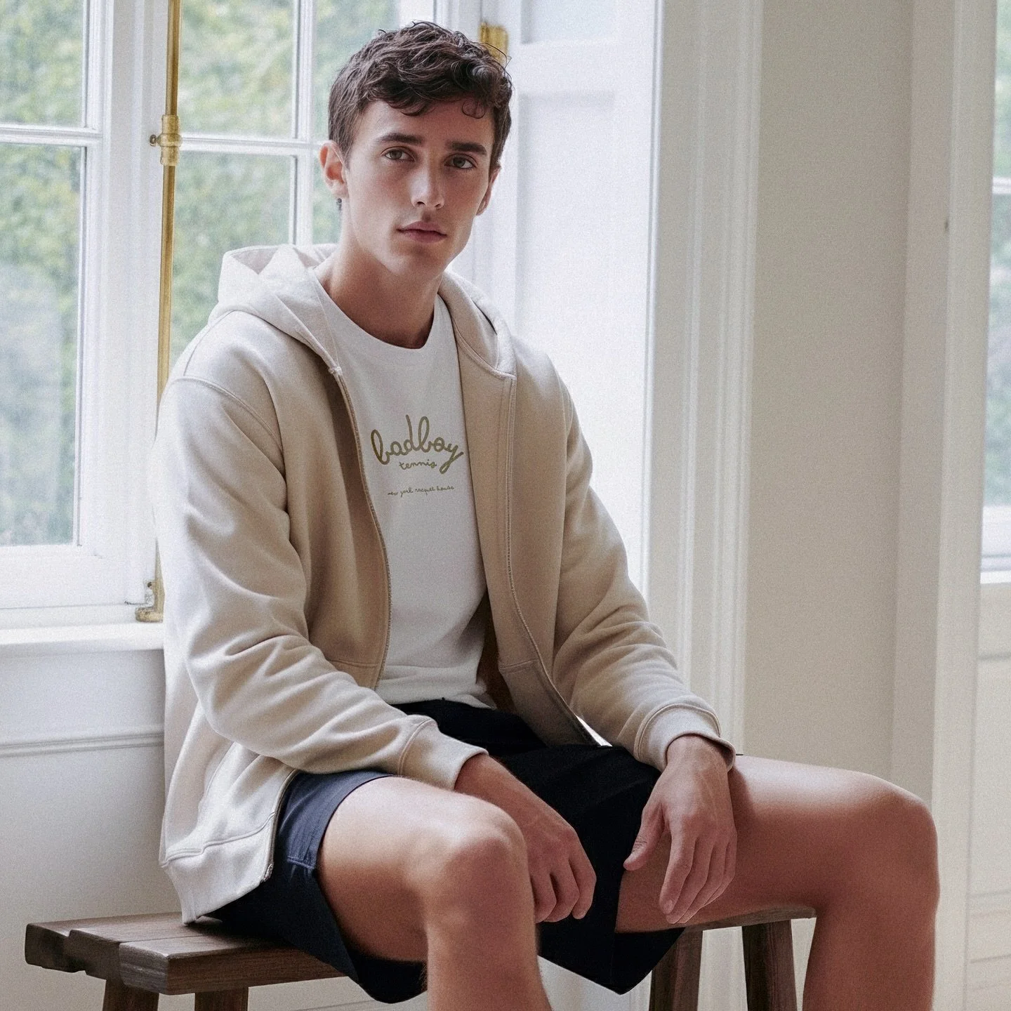 Light, warm, considered. The Madison Avenue script (ecru) meets an easy zip and tennis short for indoor winter ease.