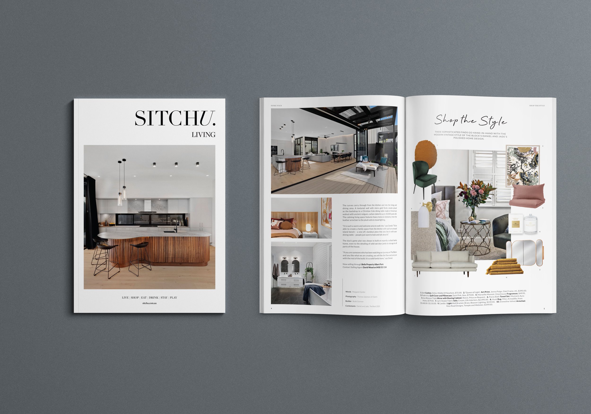 Open magazine featuring modern interior design photos, including a kitchen, living room, and bedroom, with stylish furniture and decor.