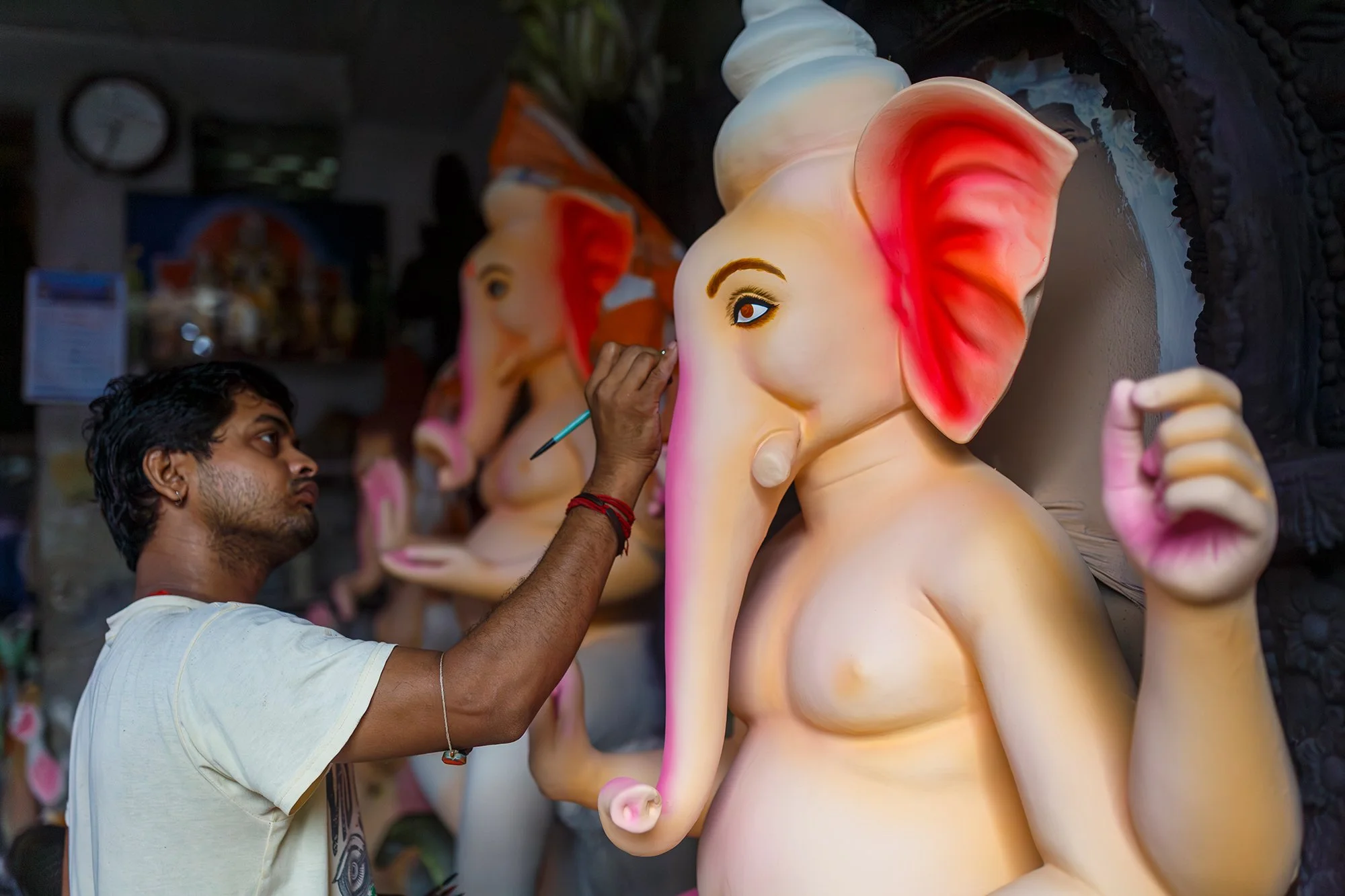 Idol Maker, Kumortuli
In Kumortuli, Kolkata, an idol maker adds the finishing touches to a Ganesha sculpture as preparations begin for the festival season.