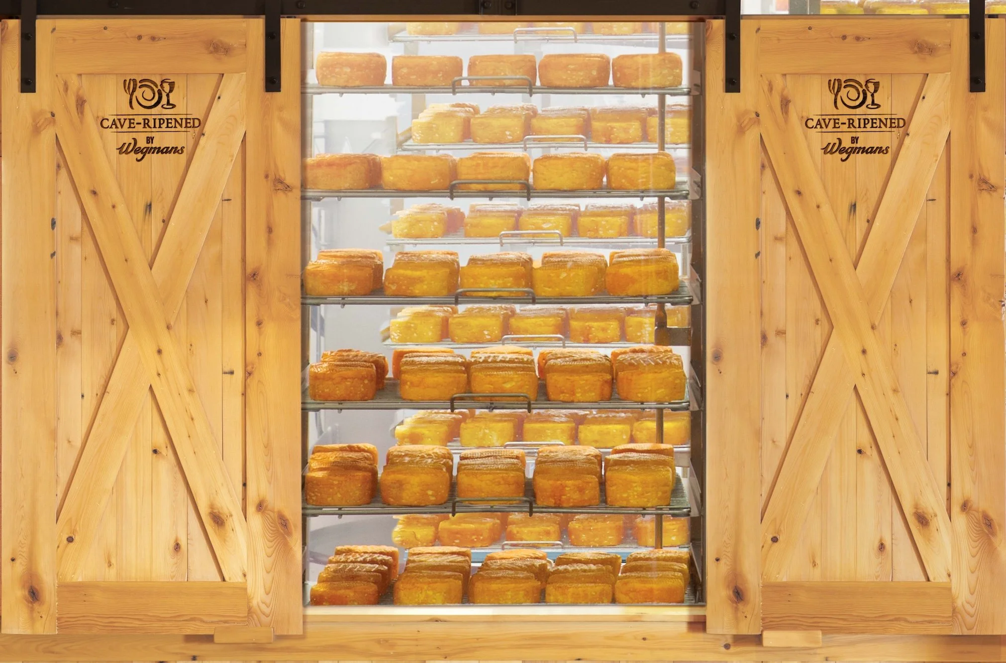 Cheeses ripening at Wegmans Cheese Caves