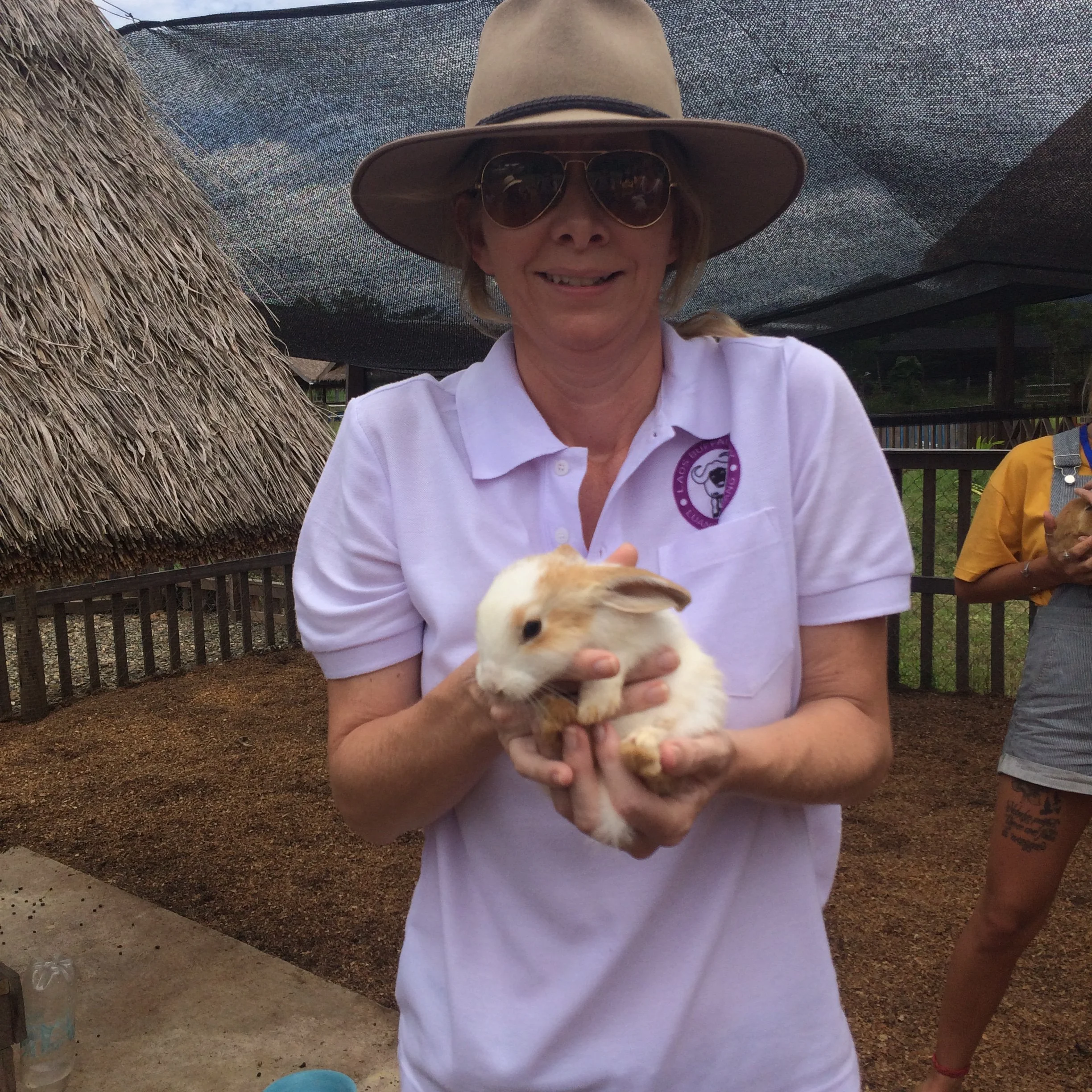 Susie Martin holding a rabbit at the farm