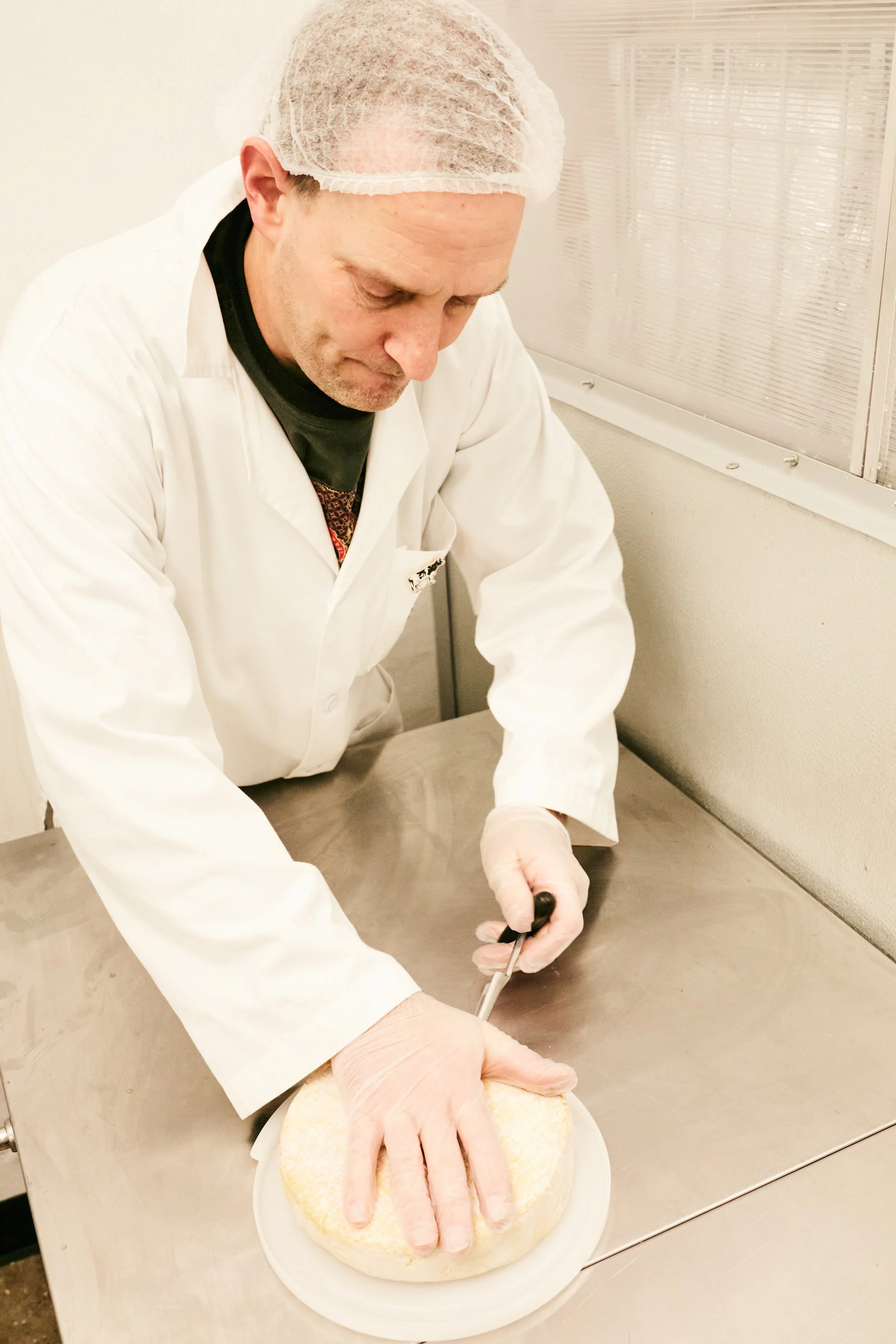 Yoav Perry making cheese