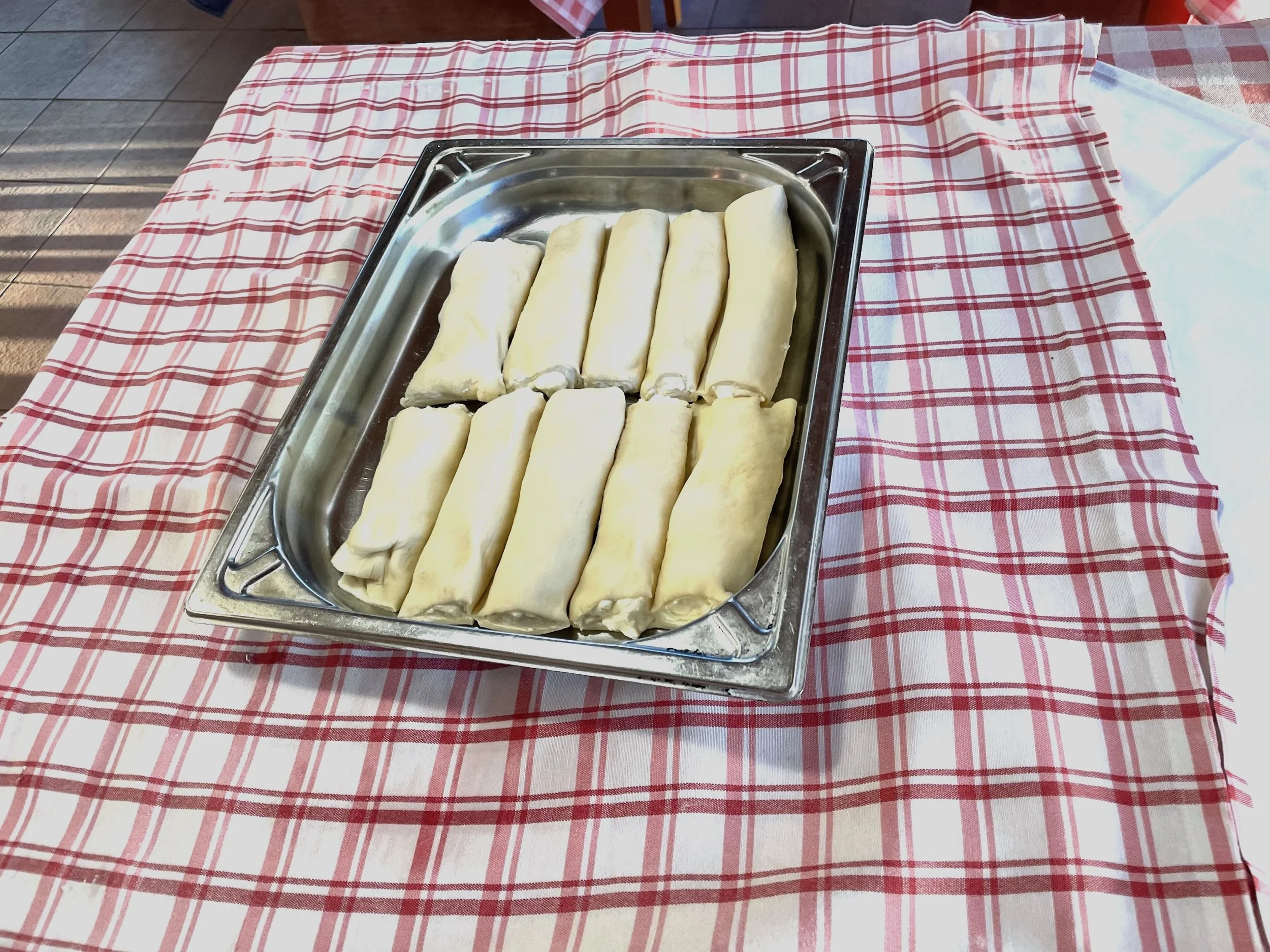 Pan of štrukli ready to be baked