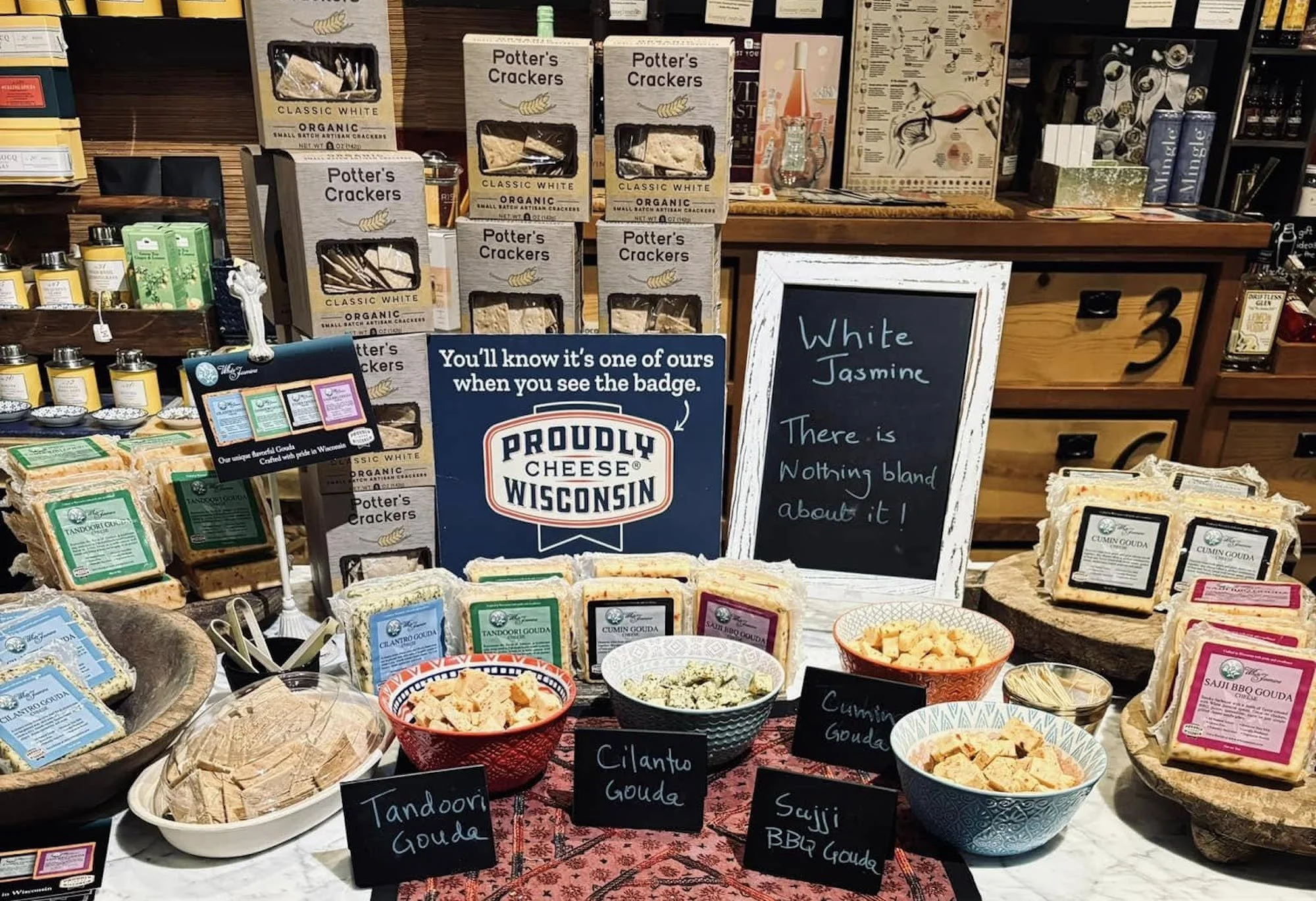 A display of White Jasmine’s Wisconsin cheeses at a specialty market