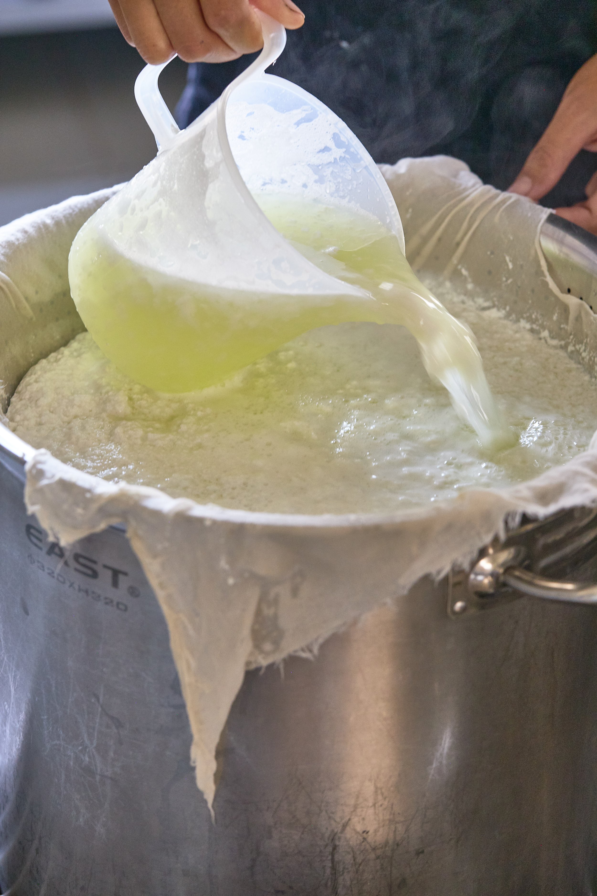 Making ricotta in Laos
