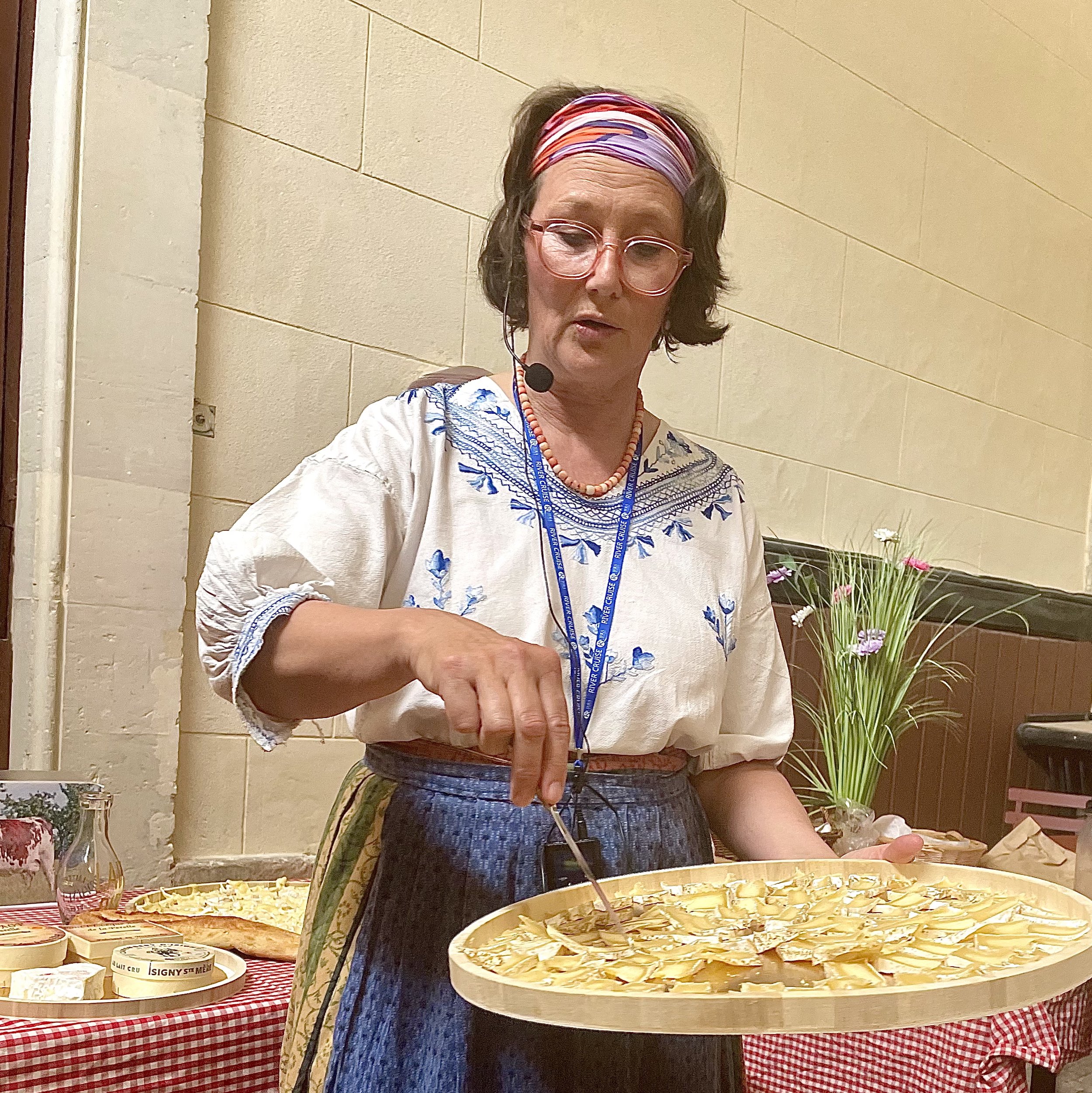 A local guide at 17th-century Bizy Castle teaches the well-known cheeses of Normandy in a former horse barn on the estate