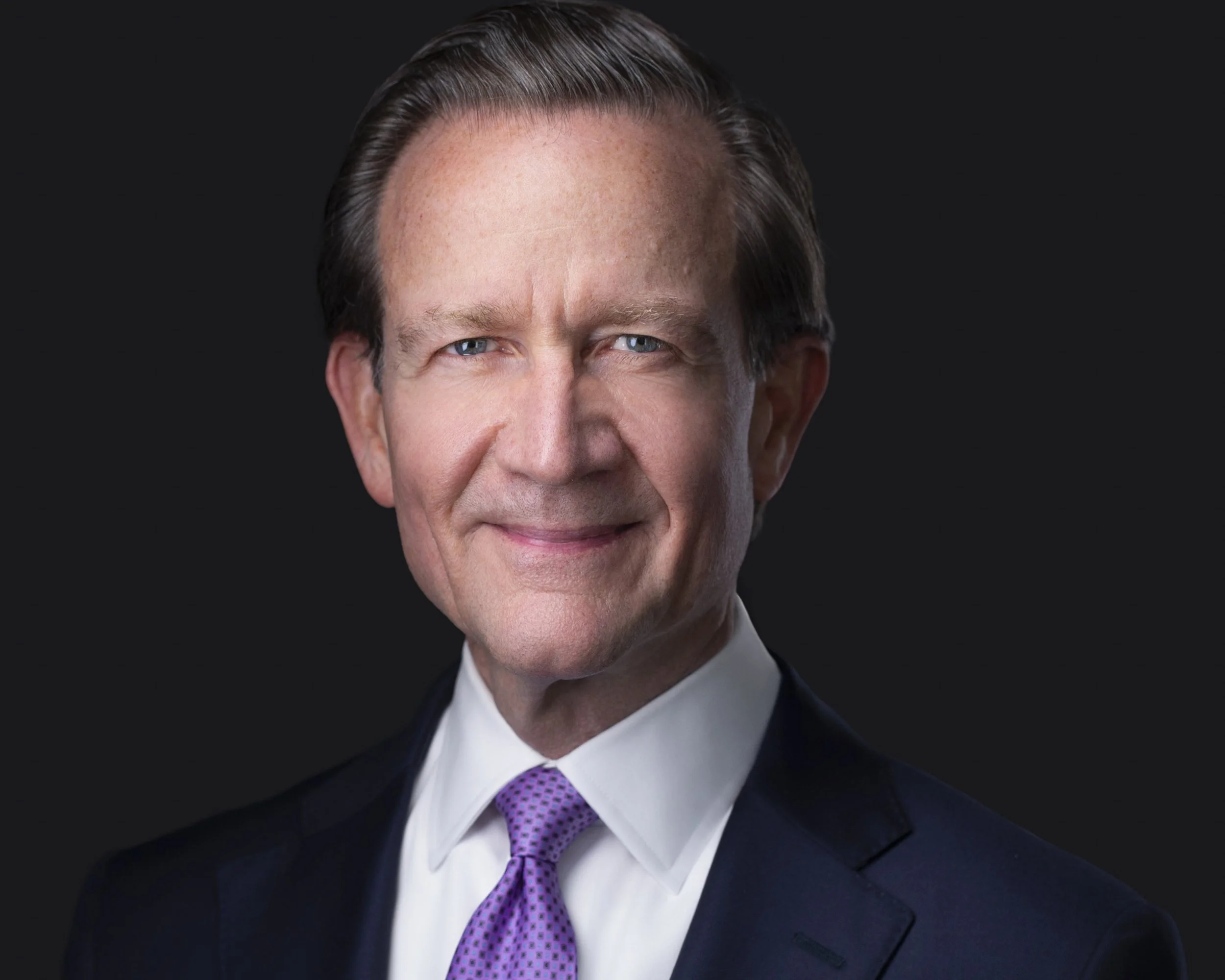 Corporate executive portrait with confident expression photographed by executive headshot photographer Dallas for professional headshots Dallas TX