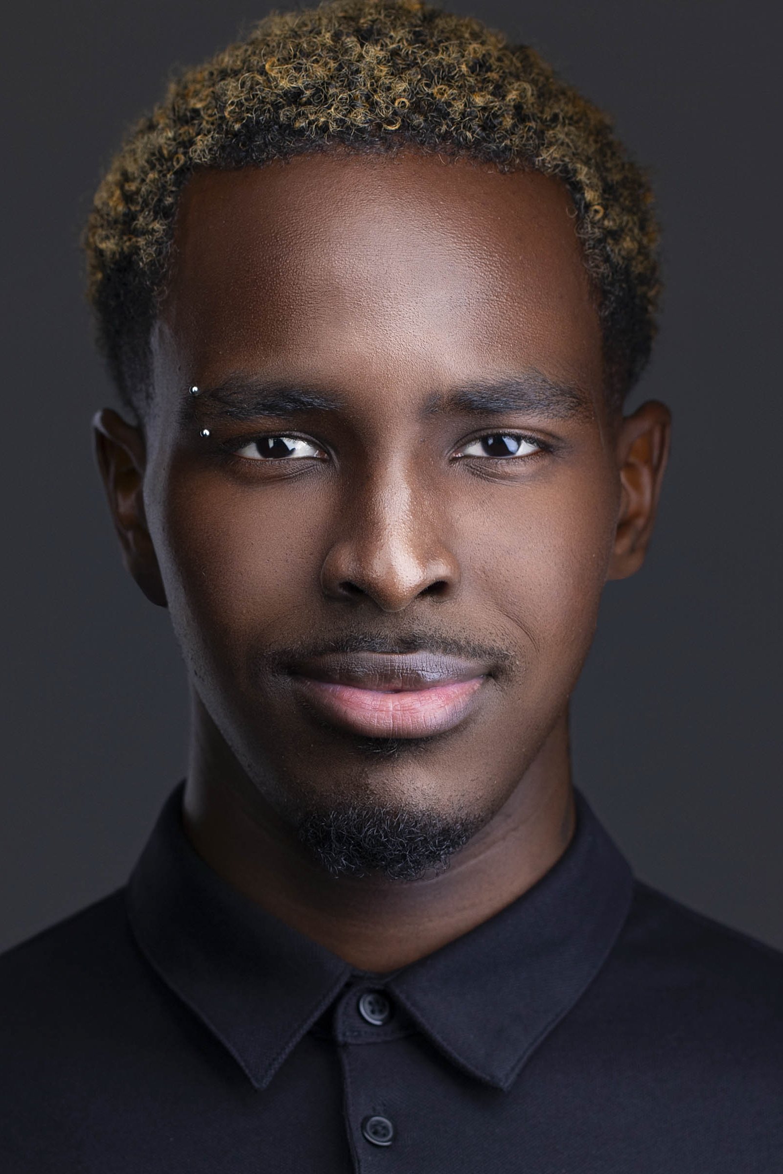 Confident acting headshot photographed in our Dallas, TX studio, designed for casting and building a modeling portfolio.