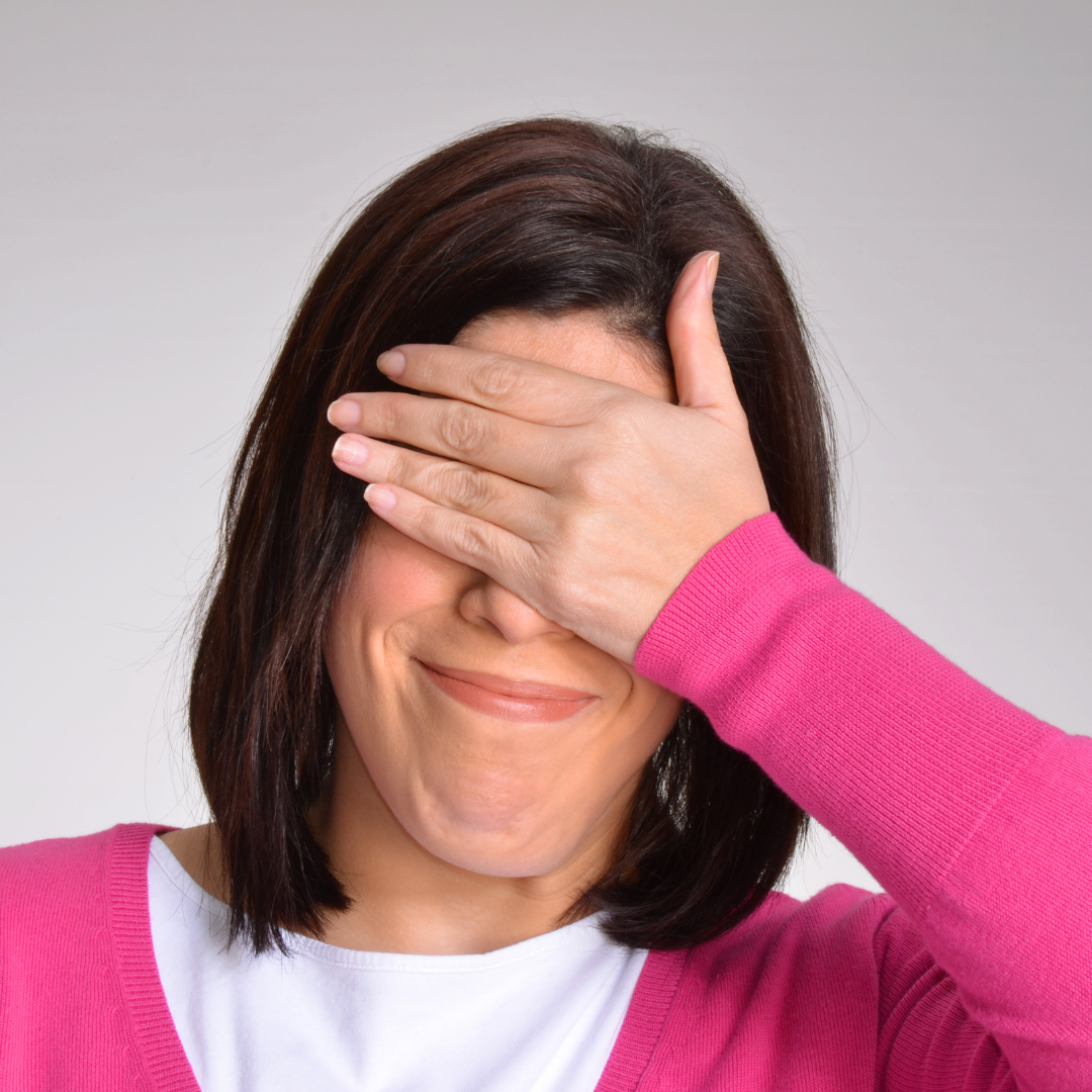 Picture of a middle-aged woman with her hand covering her eyes