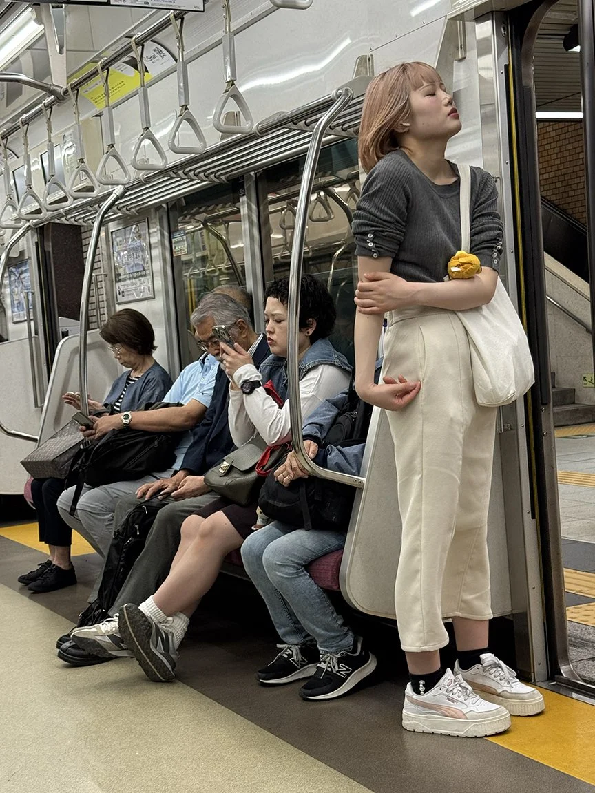 People looking at their phones, Shinjuku Line, 2025