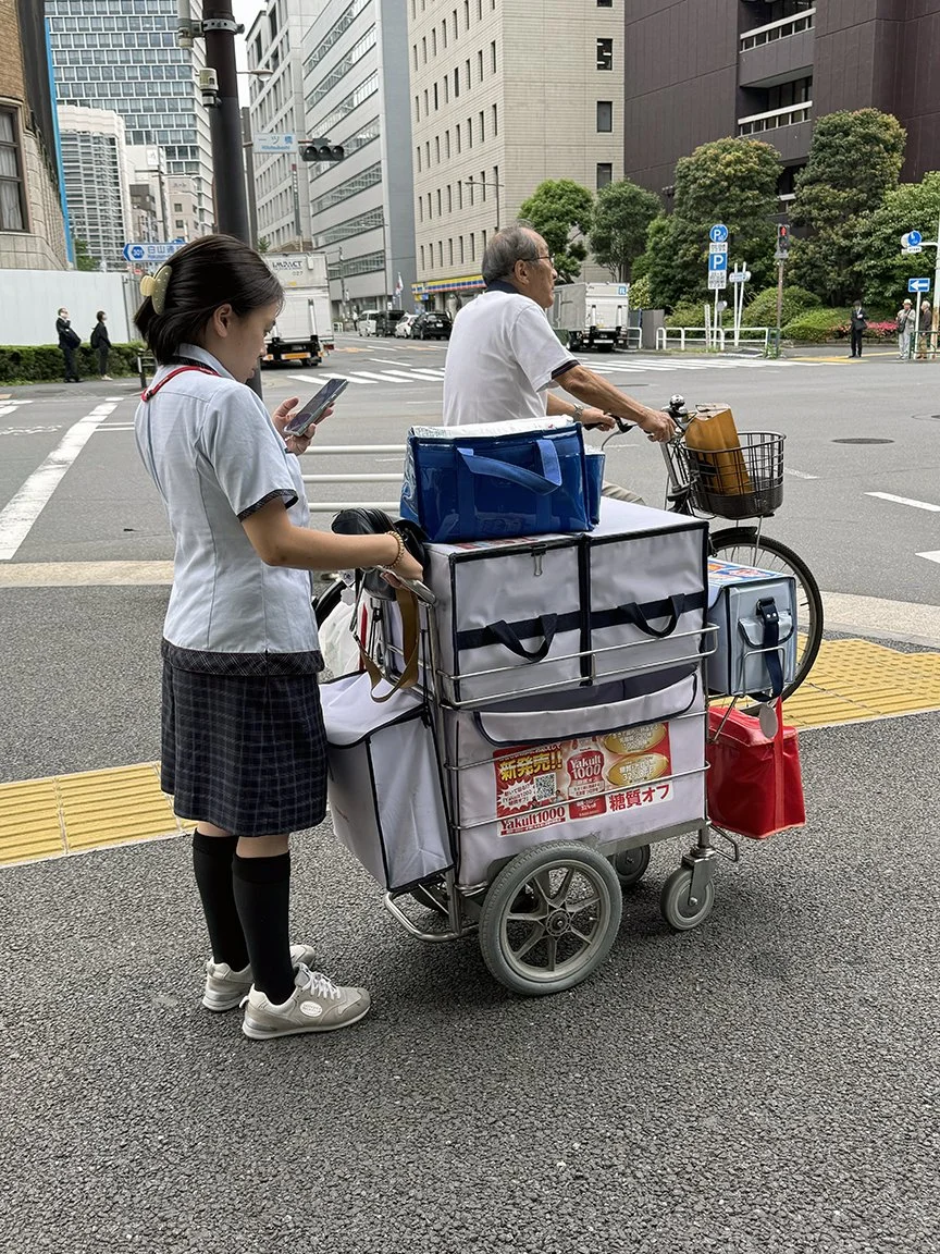 Woman looking at phone, Near the Imperial Palace, 2025