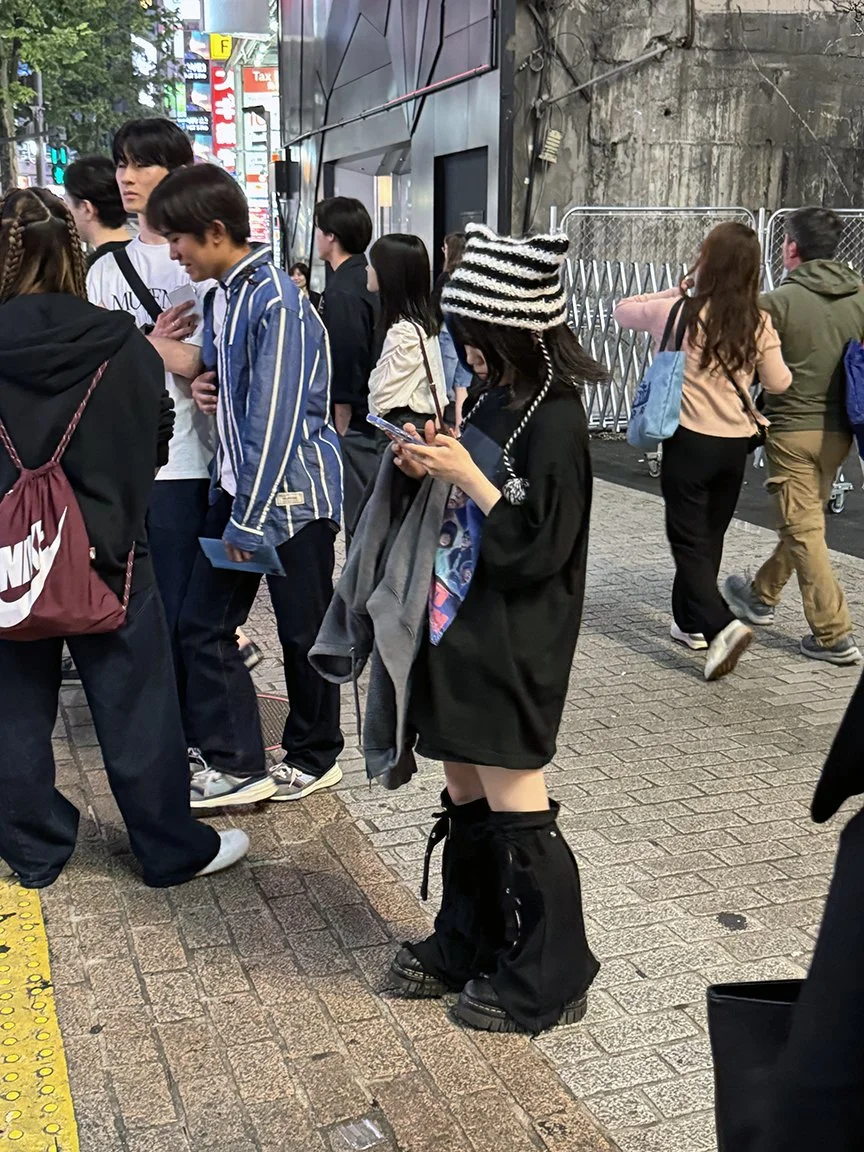 Teenager looking at phone, Ueno, 2025