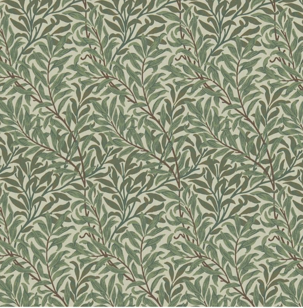 Pattern of green leafy branches on a beige background.