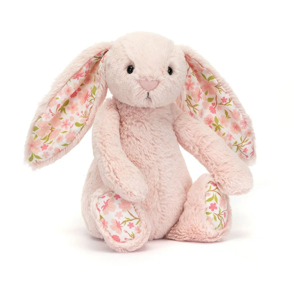Jelly cat teddy. A pink plush bunny stuffed animal with floral-patterned ears and paws.