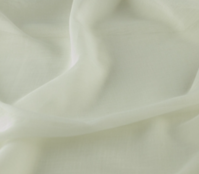 Close-up of soft, creamy yellow fabric with smooth, flowing folds.