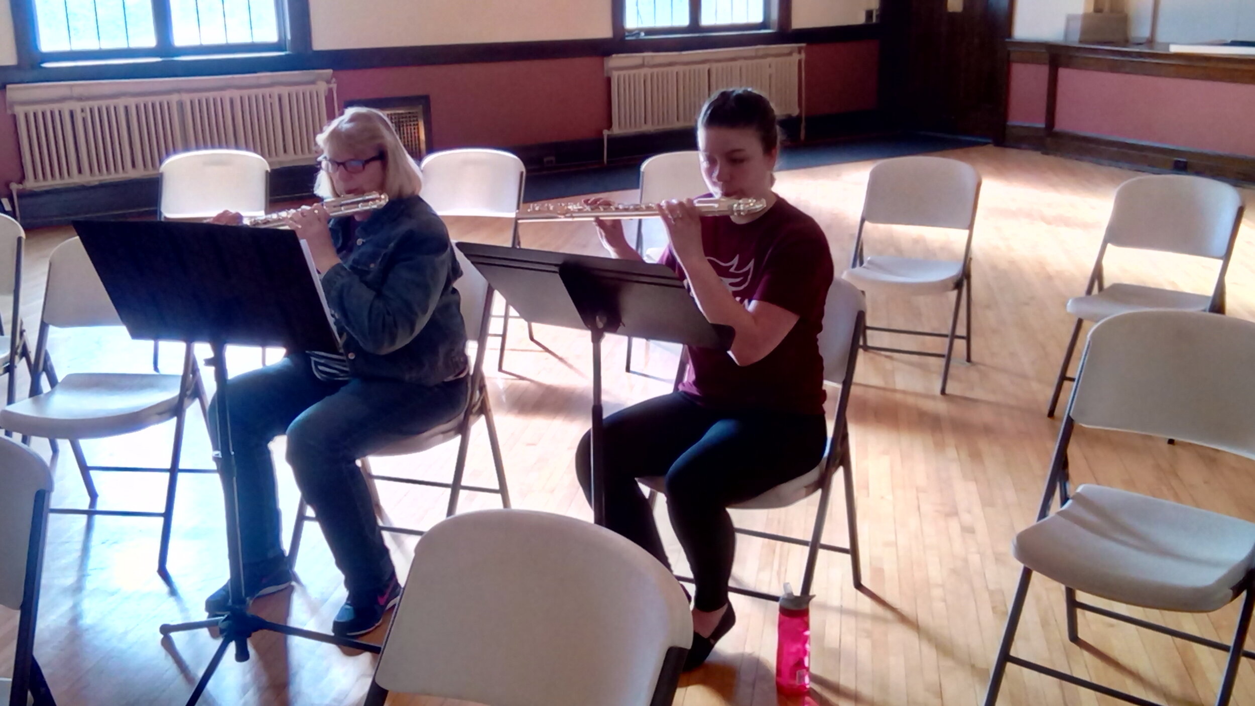 Members playing alto and bass flute