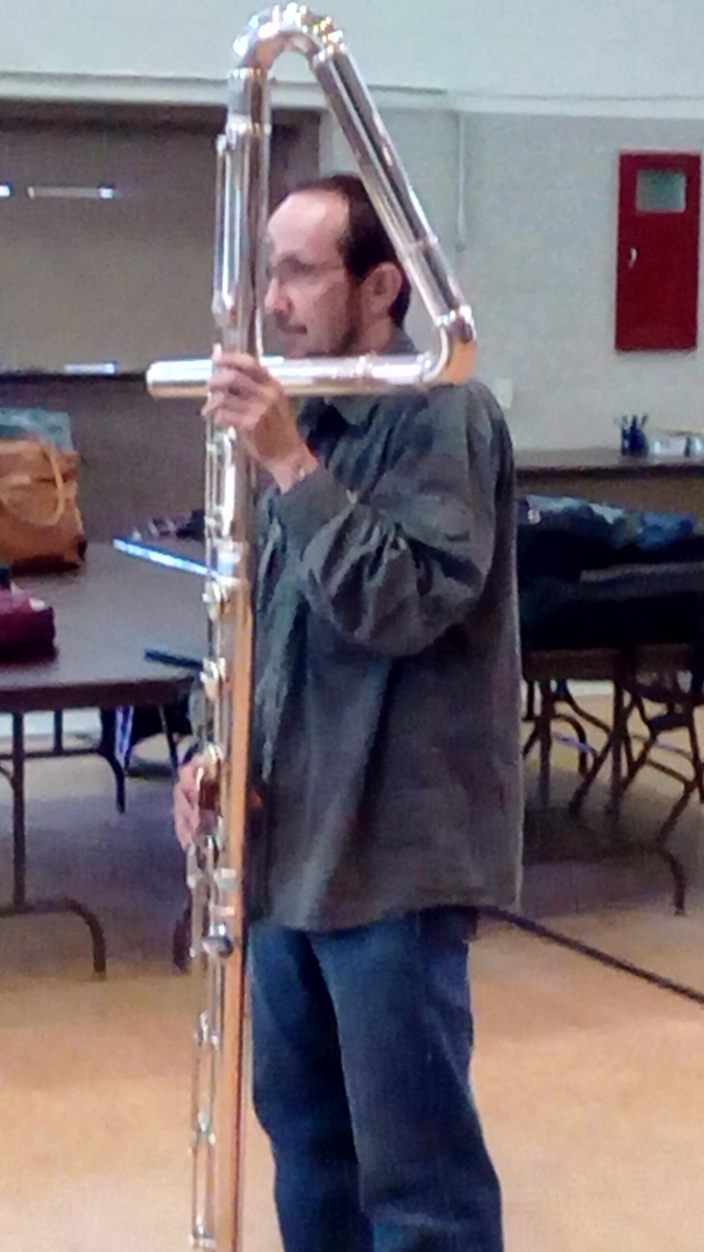 Member playing contrabass flute