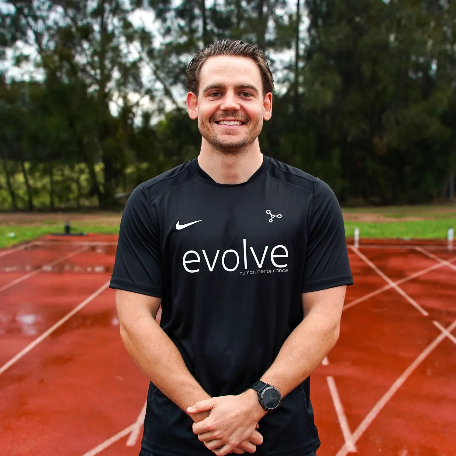 Man standing in front of running track