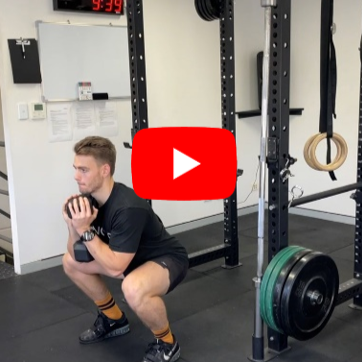 Run athlete doing a squat in the gym strength training