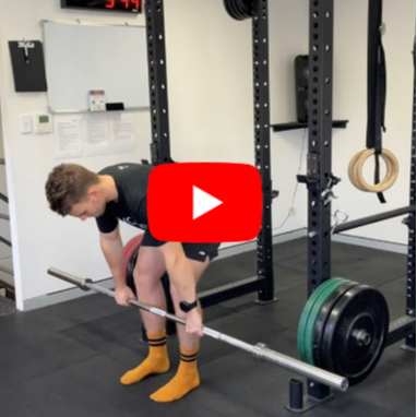 A runner doing a barbell rdl in the gym to improve their running performance
