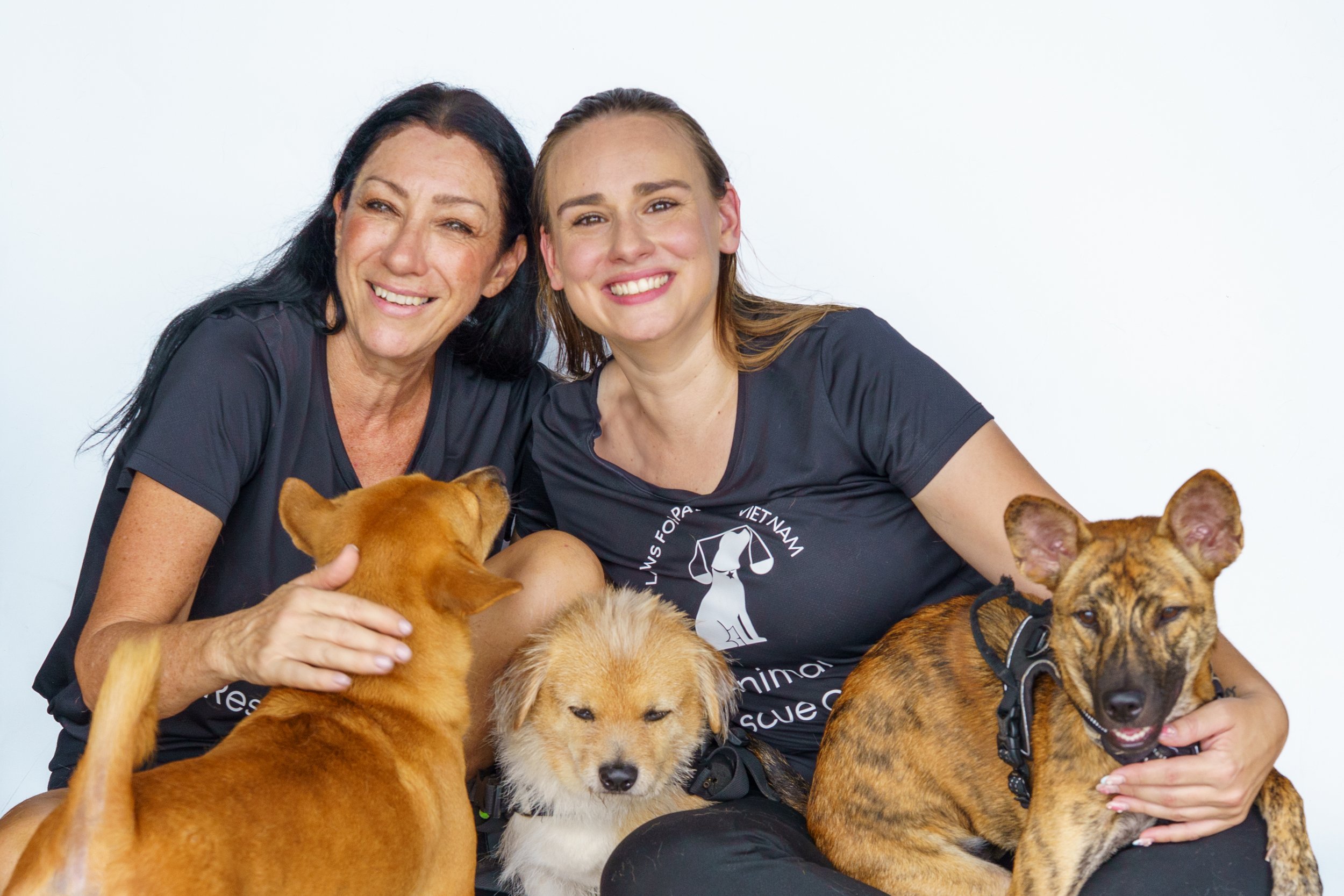 Elizabeth and Carmen with rescue dogs